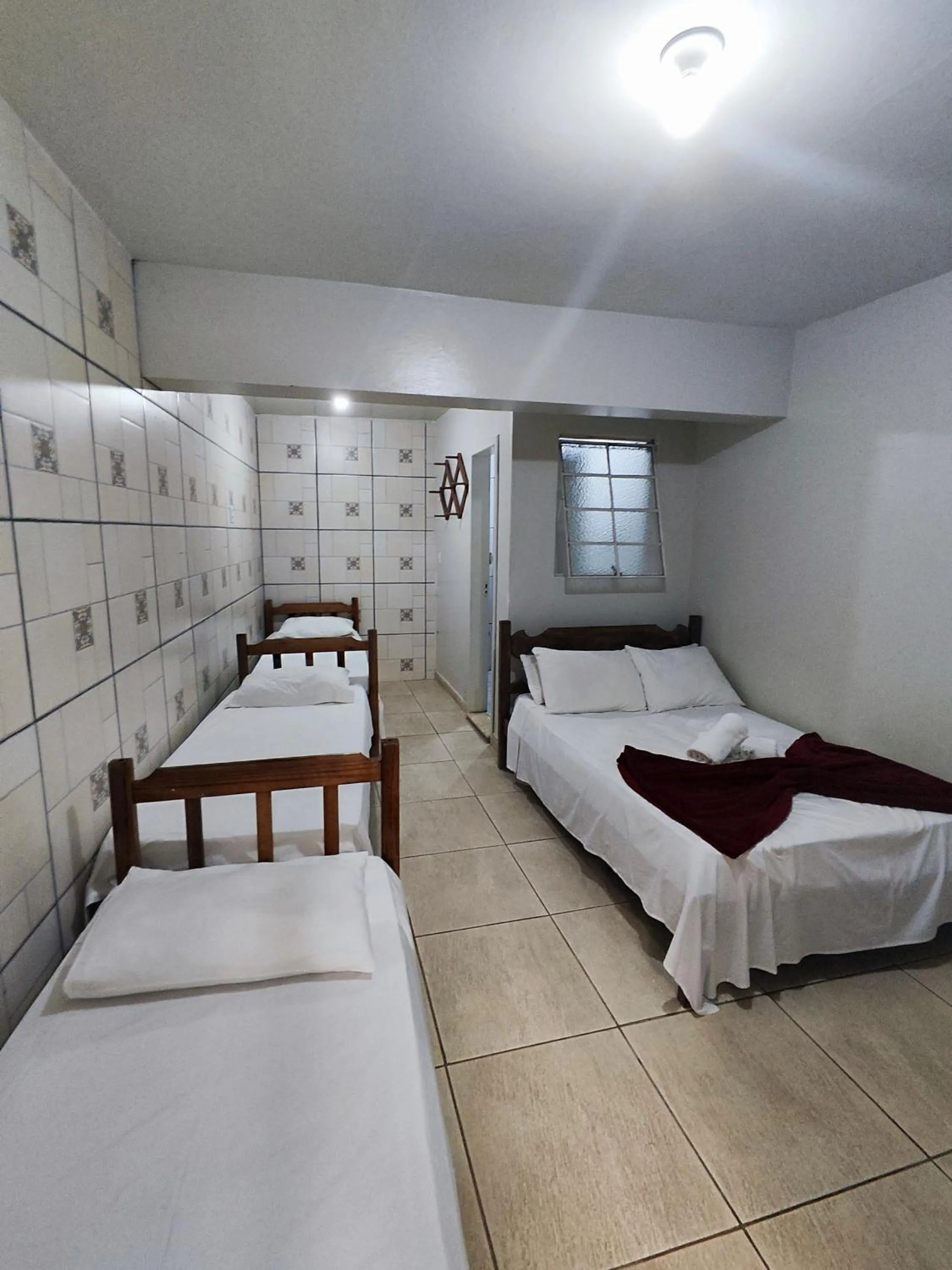 Bed in Pousada Acayaca