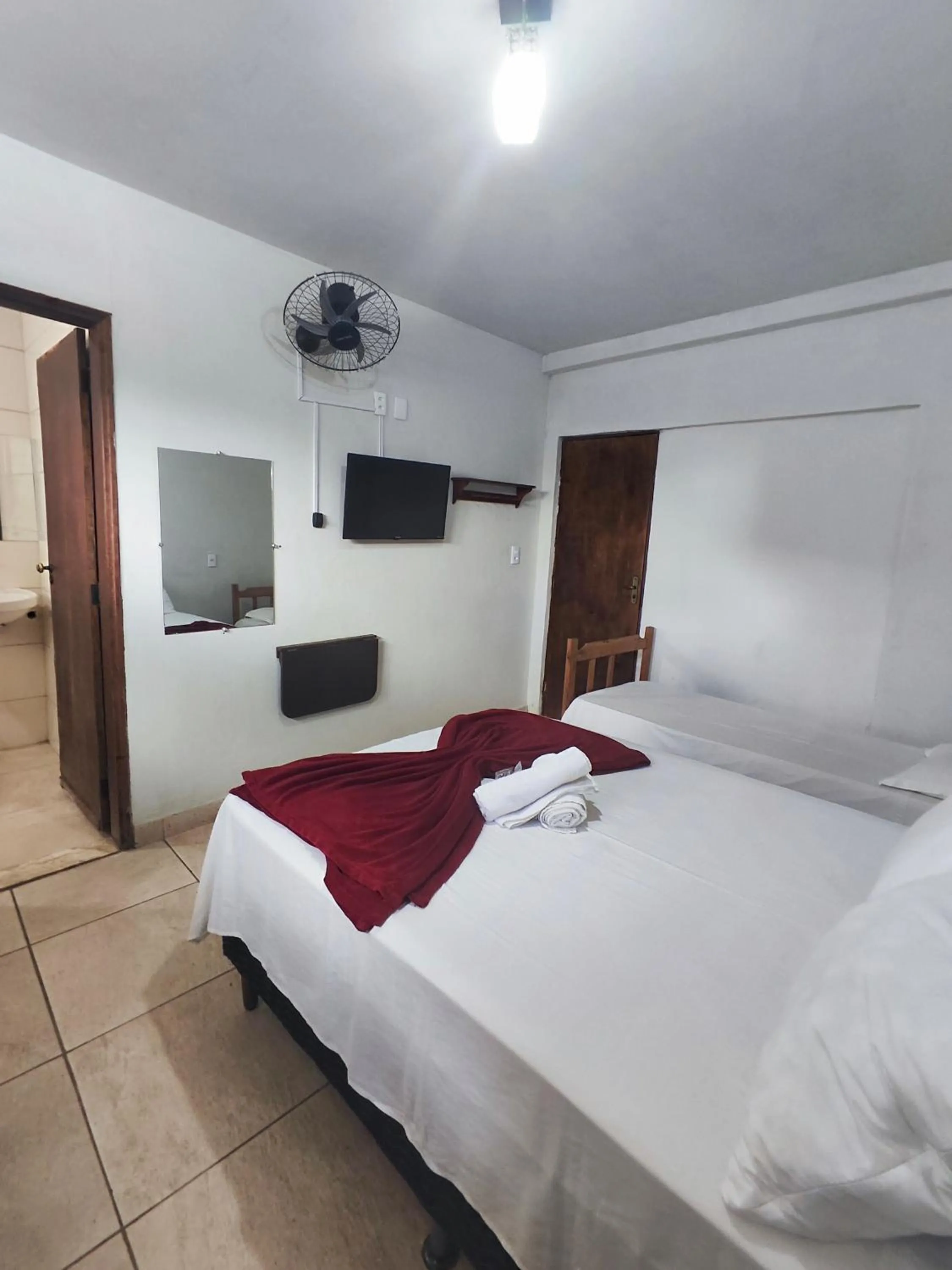 Bed in Pousada Acayaca