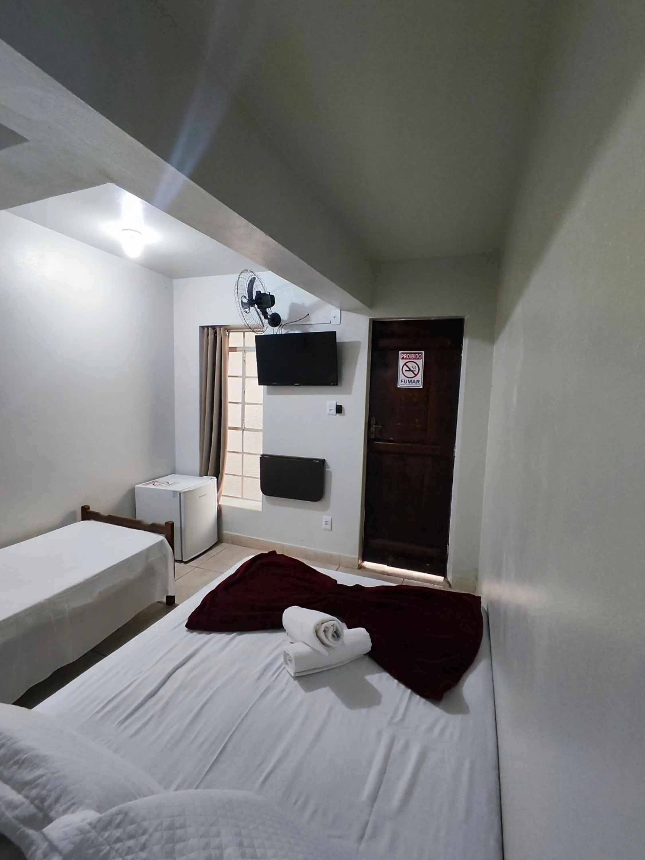 Bed in Pousada Acayaca