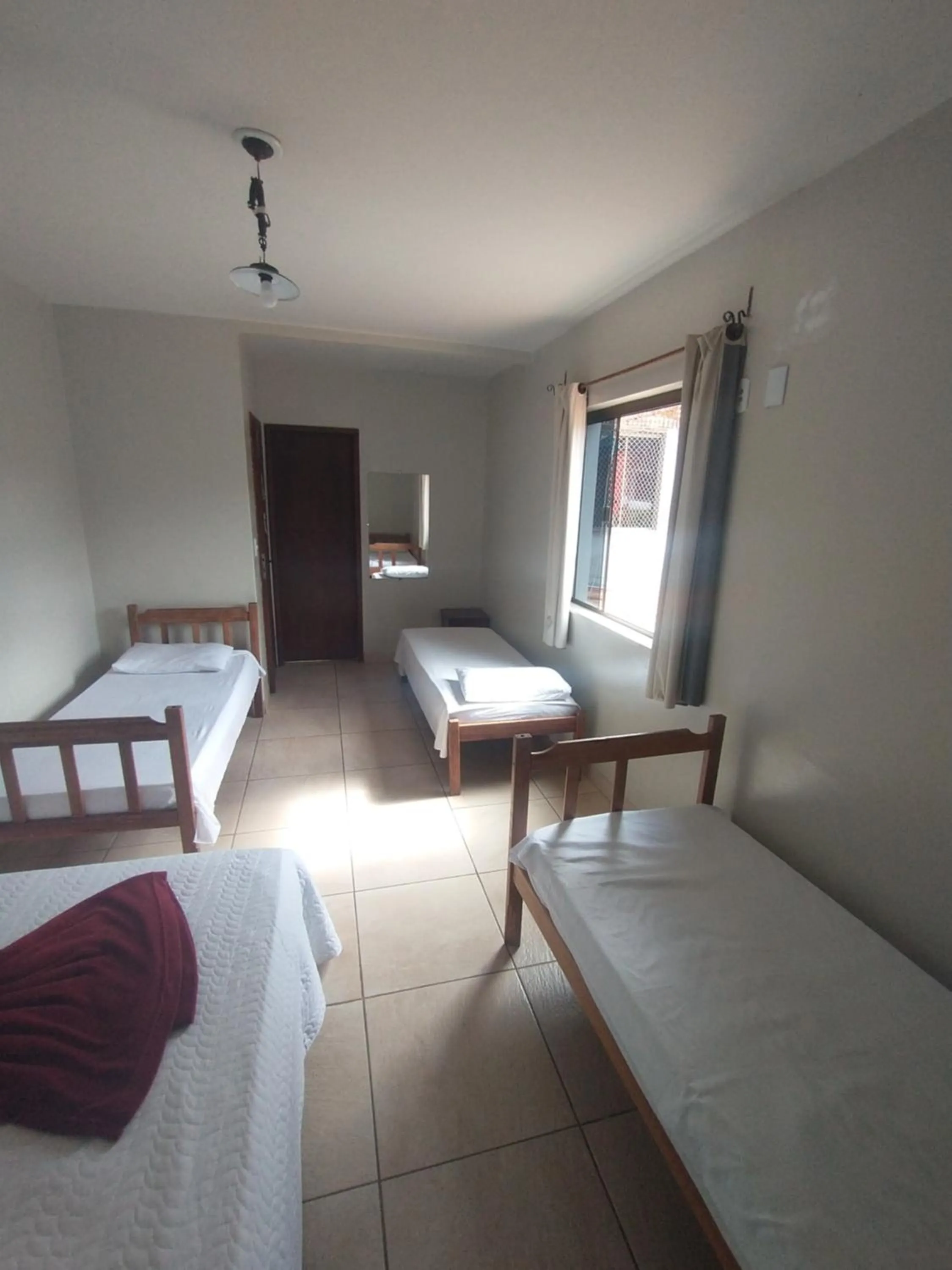 Bed in Pousada Acayaca