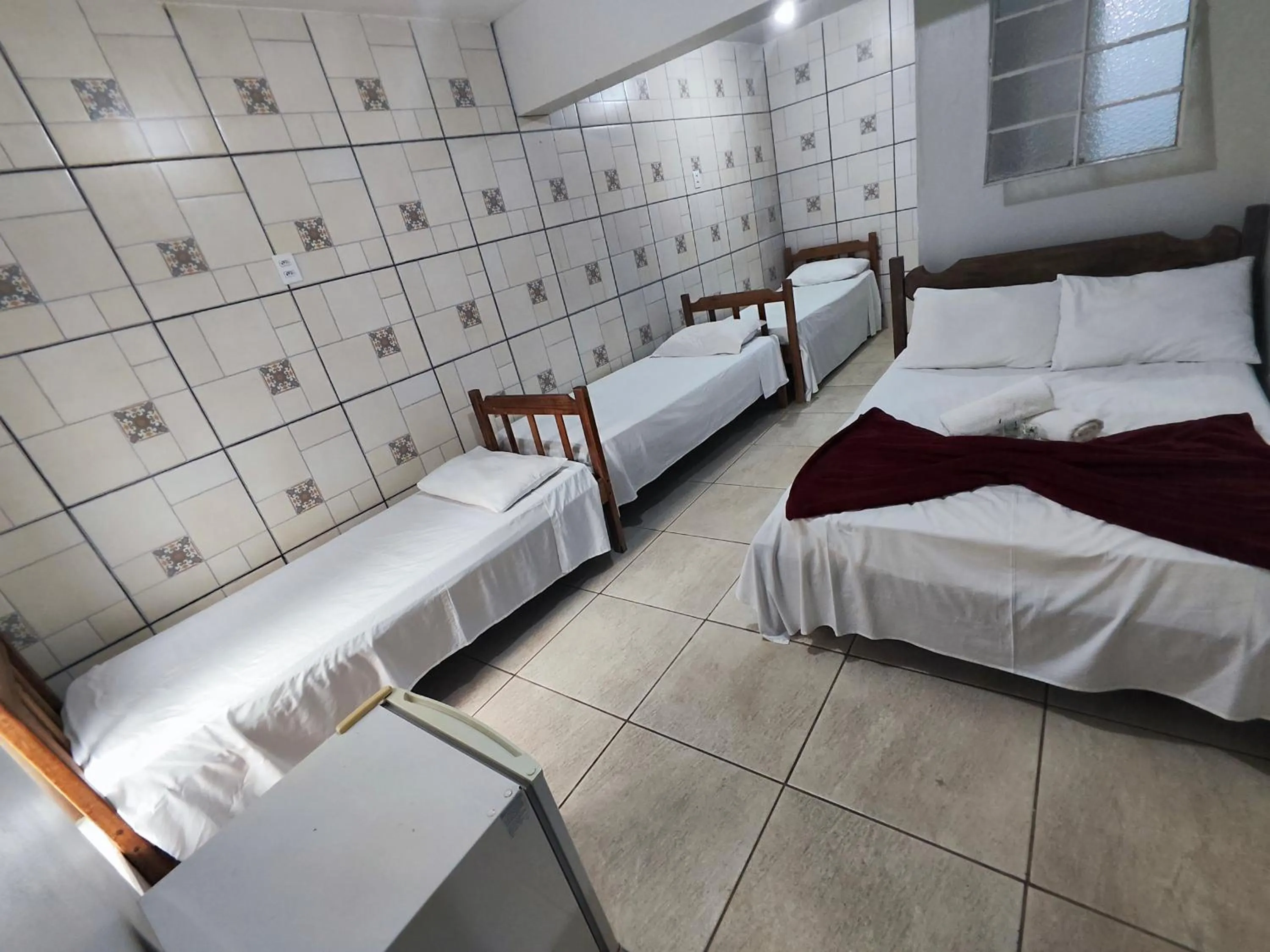 Bed in Pousada Acayaca