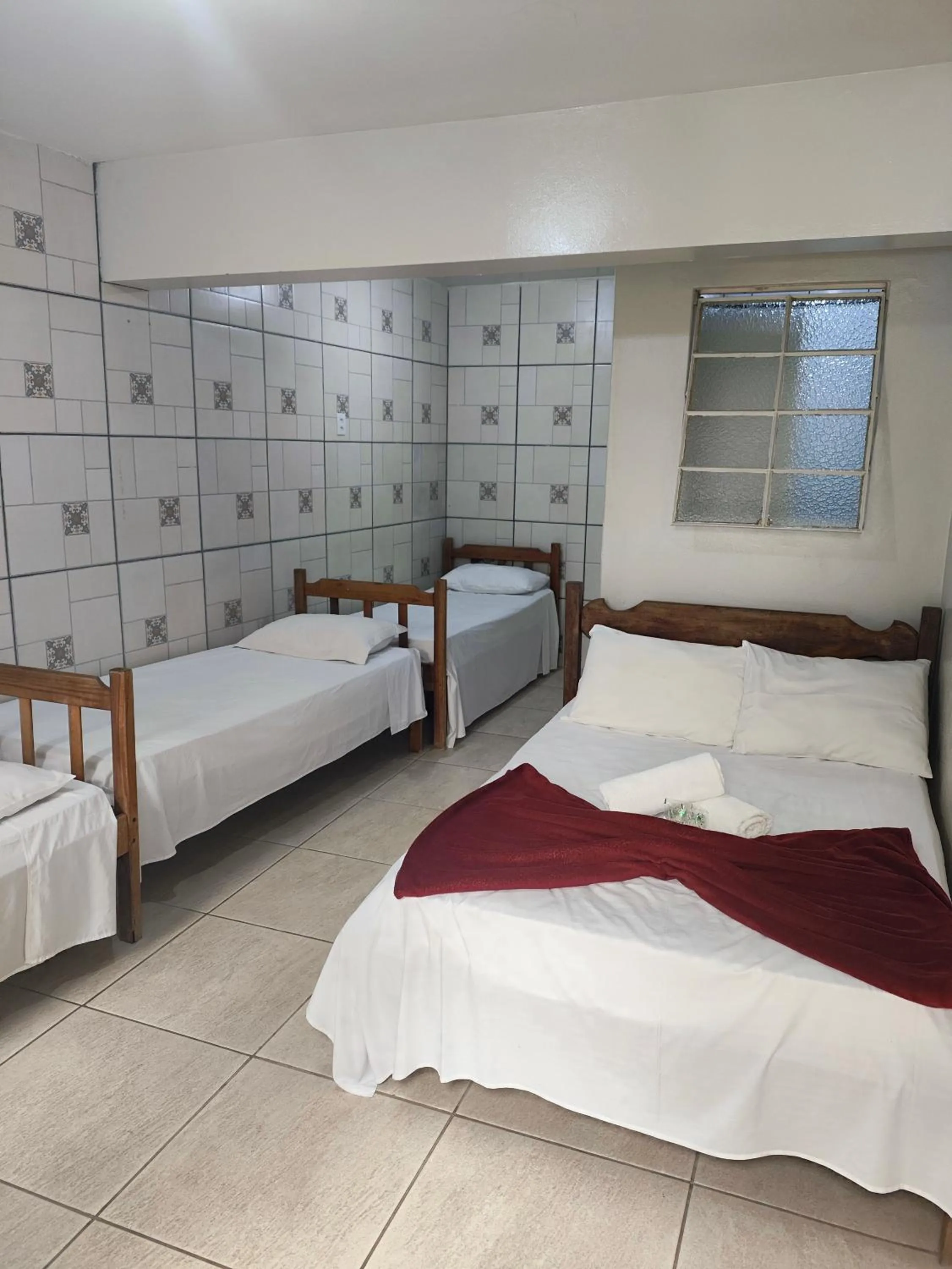 Bed in Pousada Acayaca