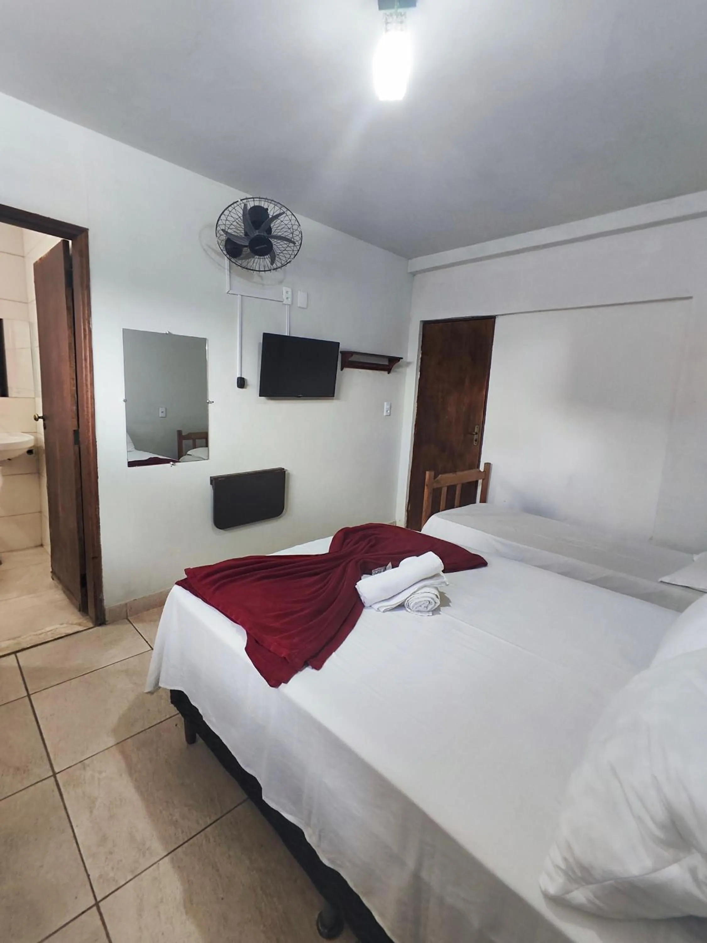 Bed in Pousada Acayaca