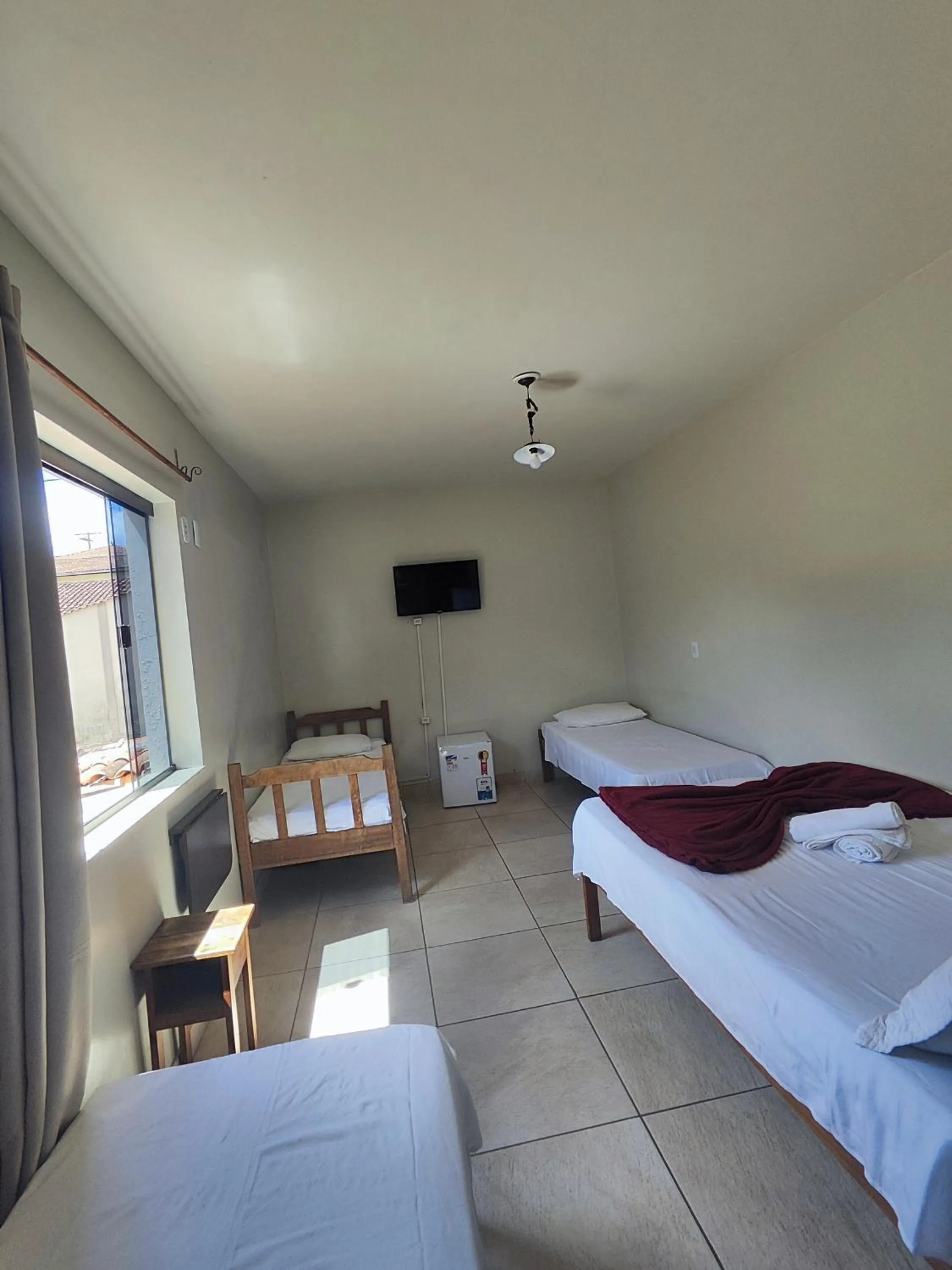 Bed in Pousada Acayaca