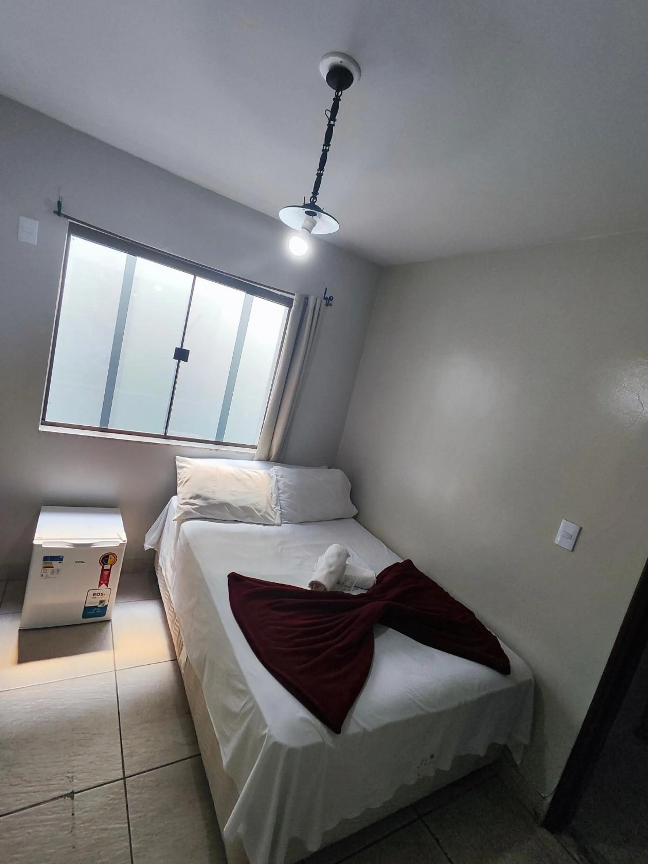 Bed in Pousada Acayaca