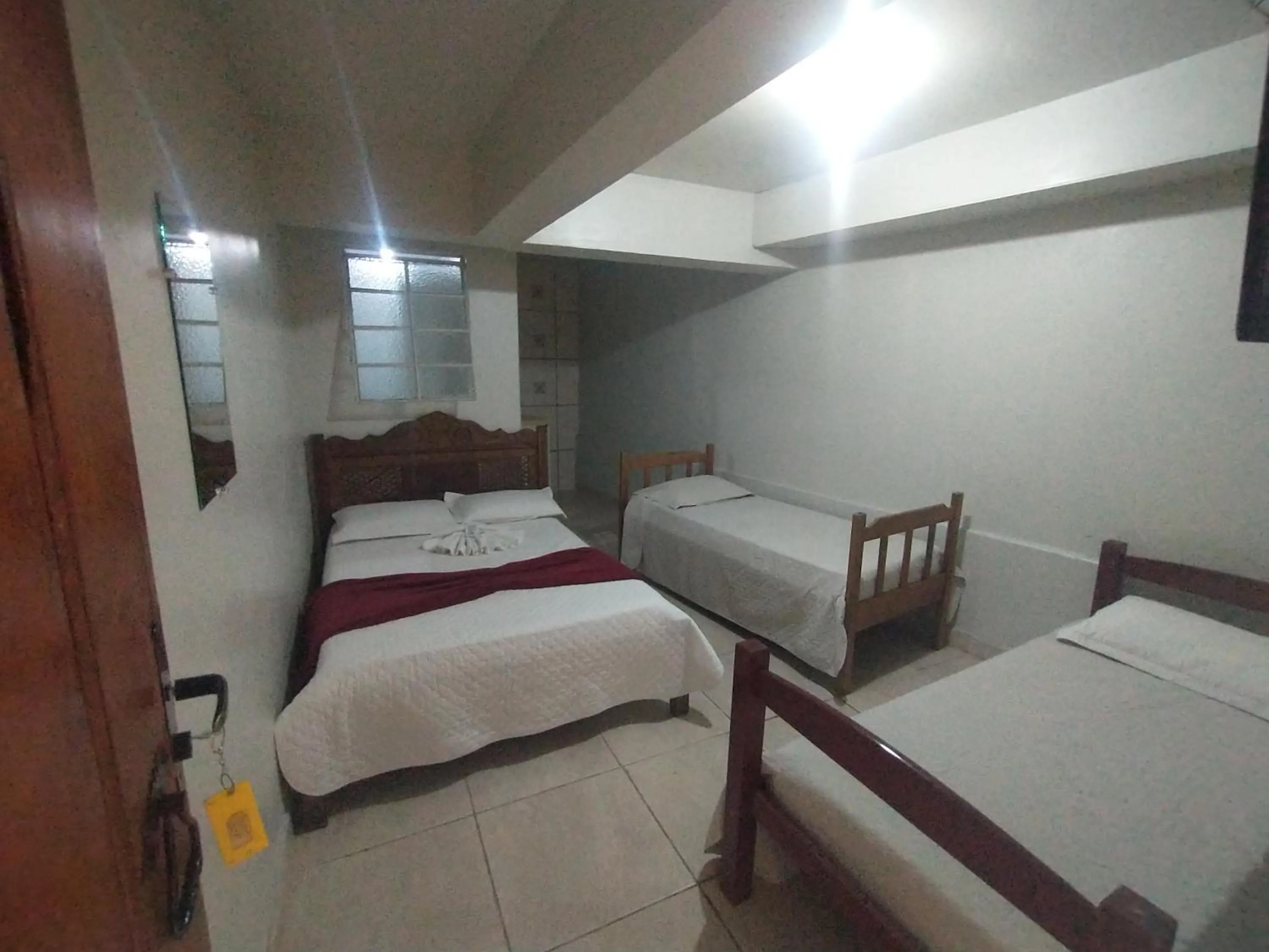 Bed in Pousada Acayaca