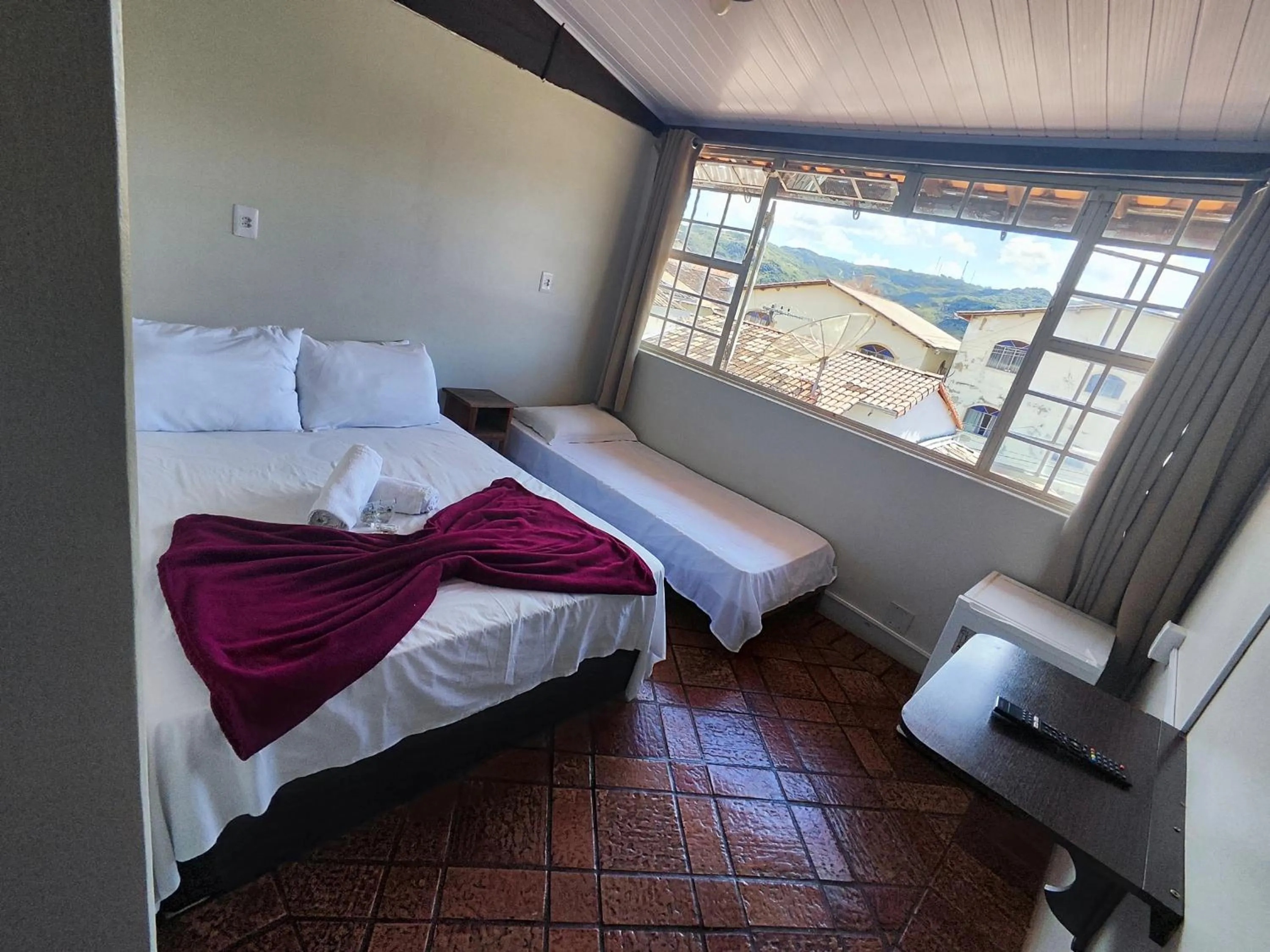 Bed in Pousada Acayaca