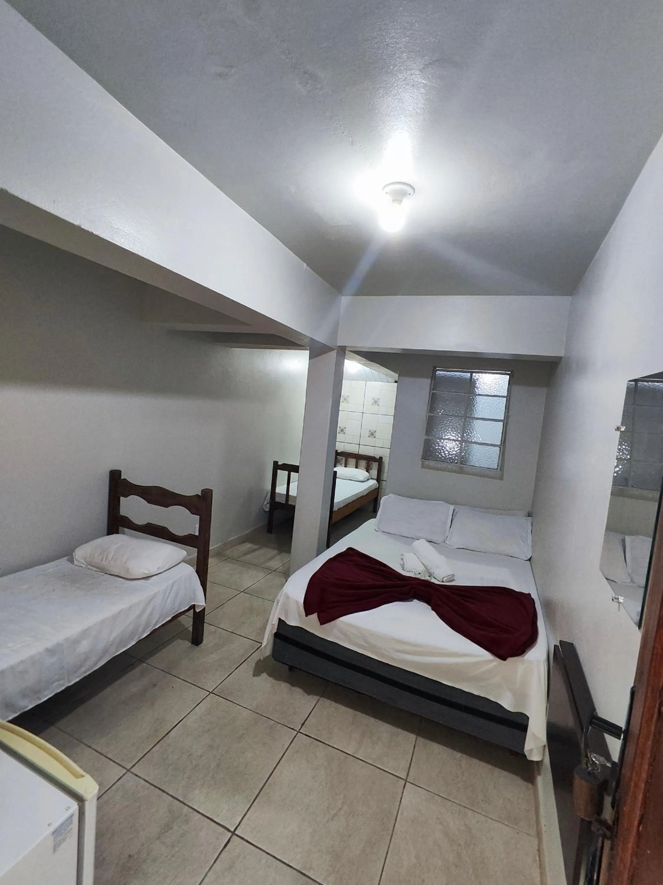 Bed in Pousada Acayaca