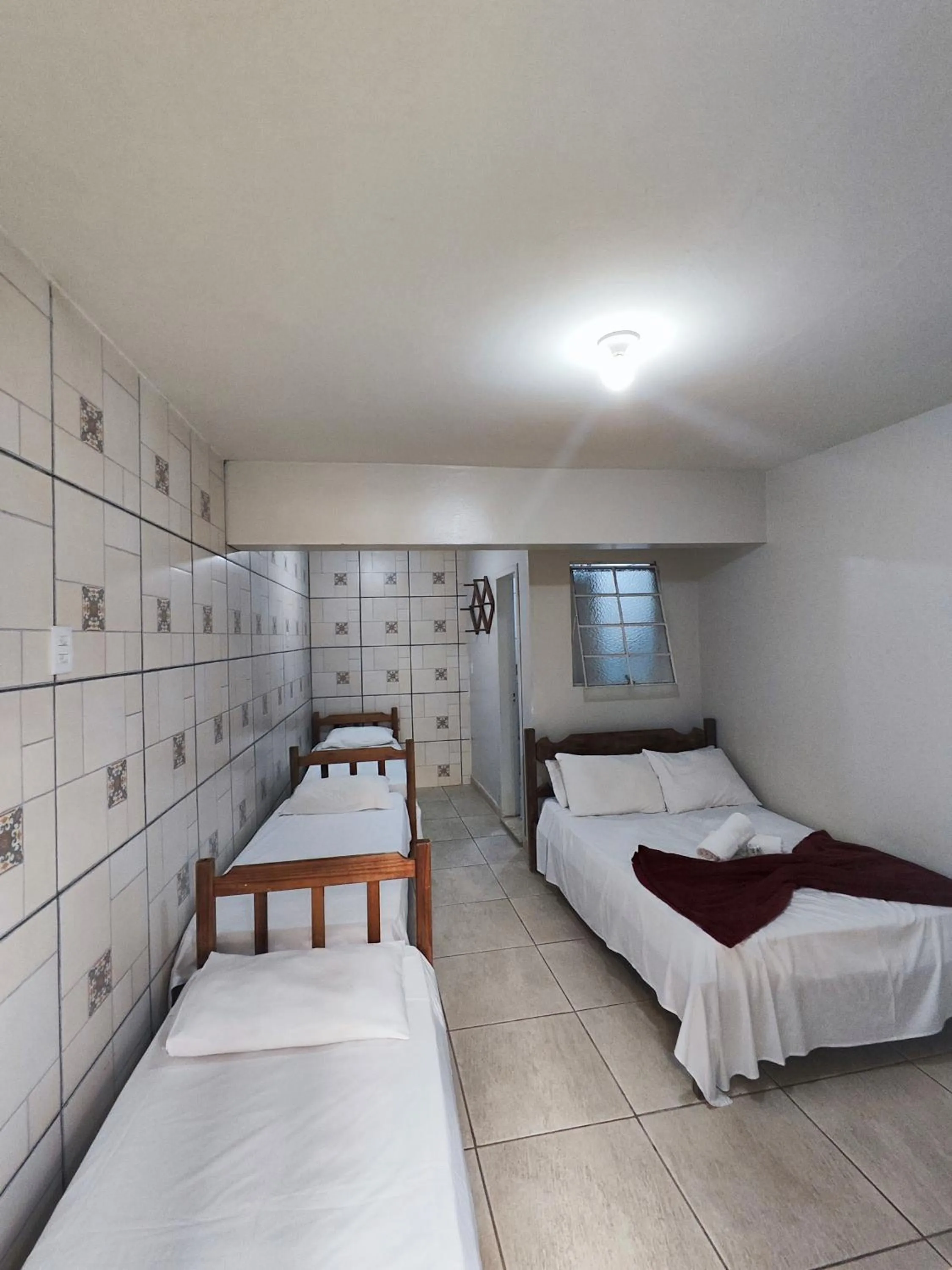 Bed in Pousada Acayaca