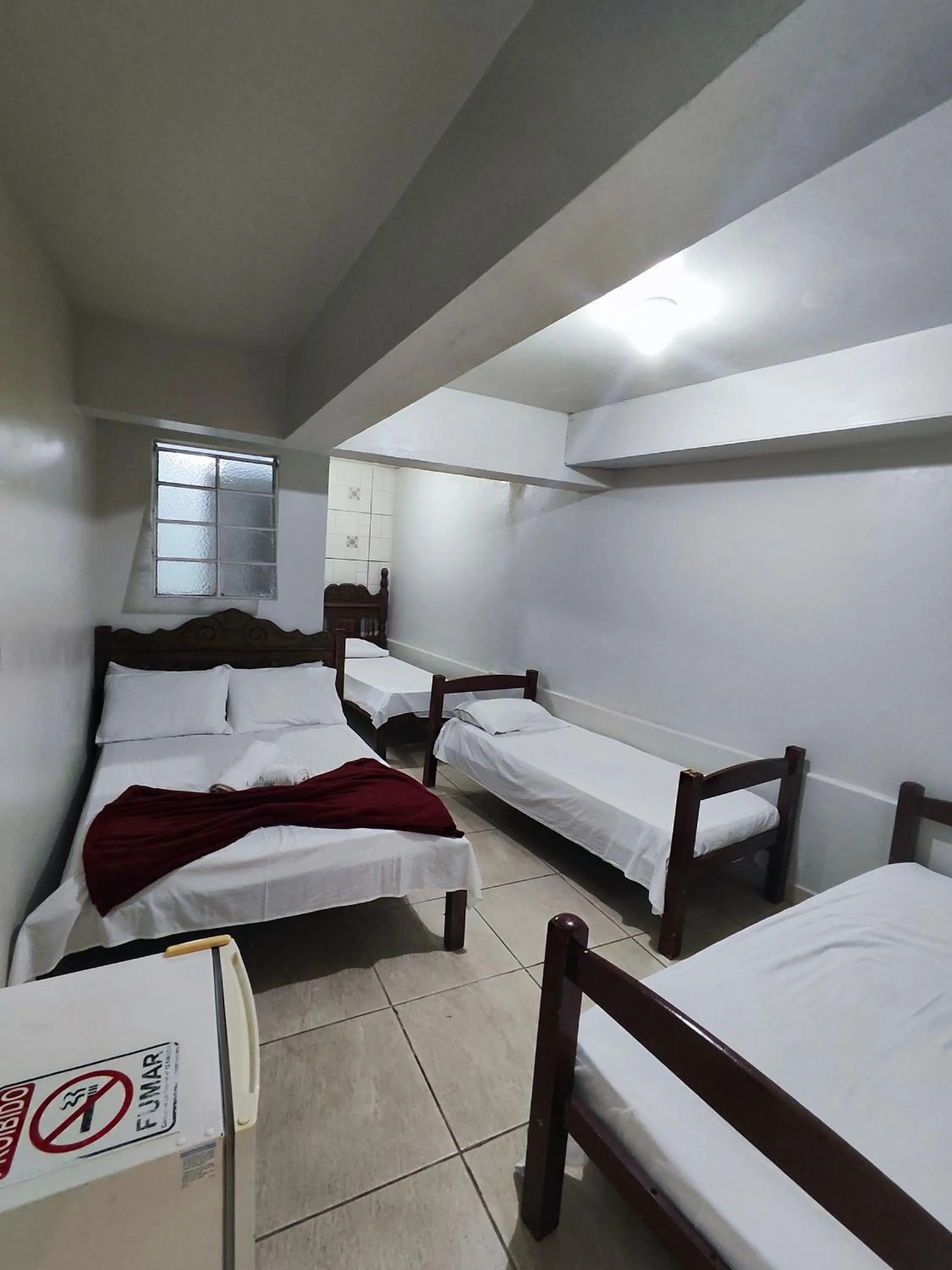 Bed in Pousada Acayaca