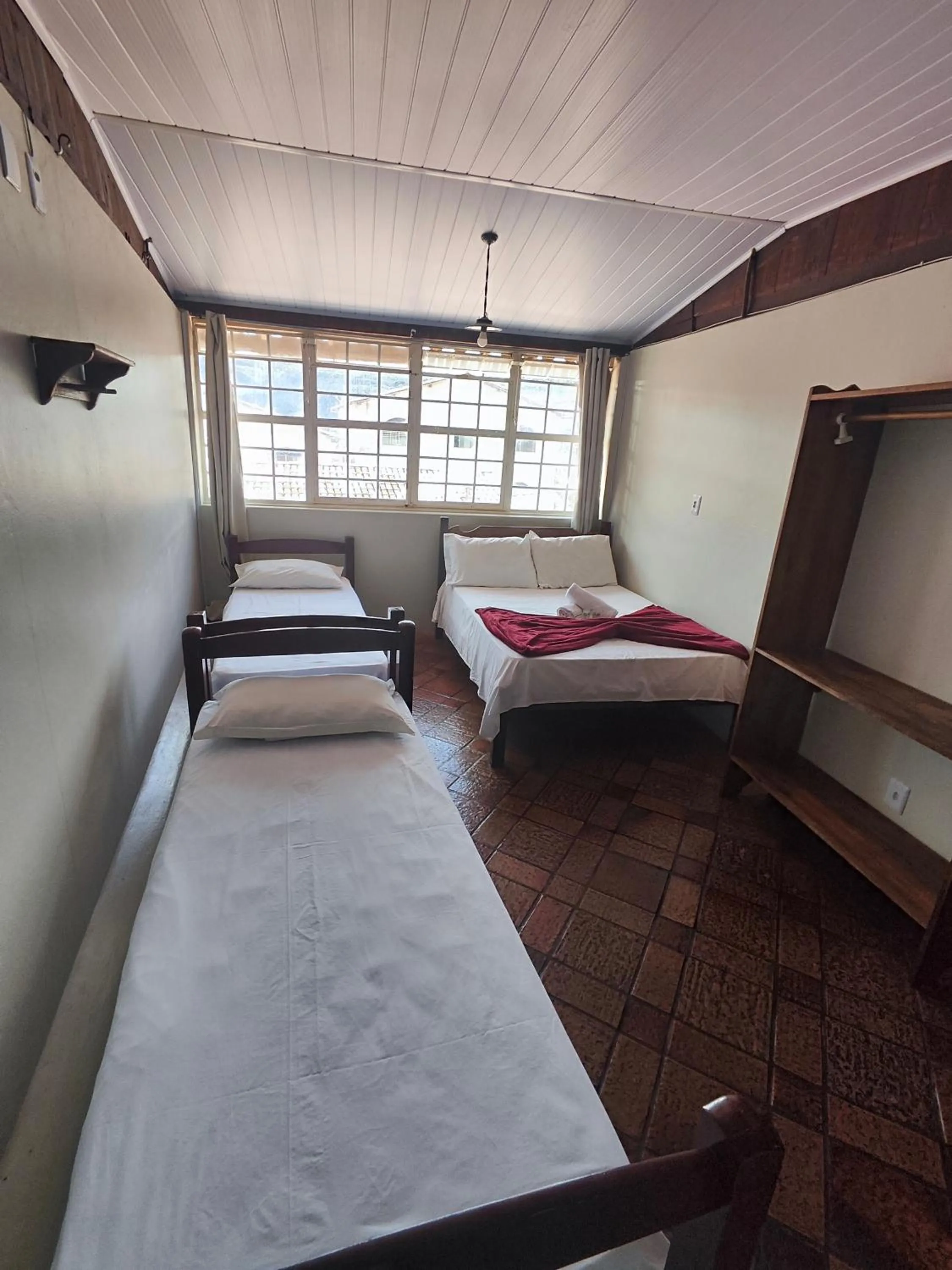 Bed in Pousada Acayaca