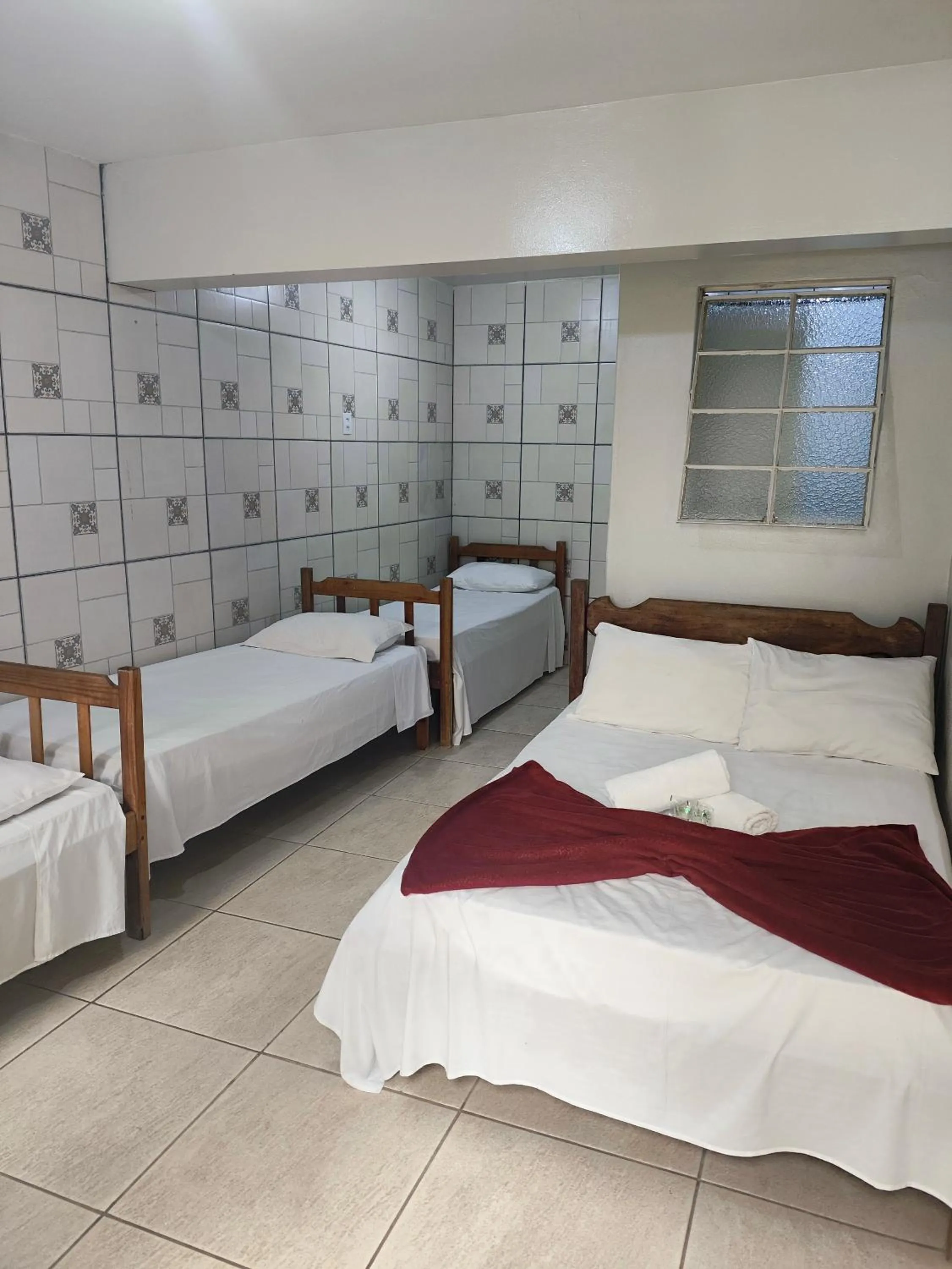 Bed in Pousada Acayaca