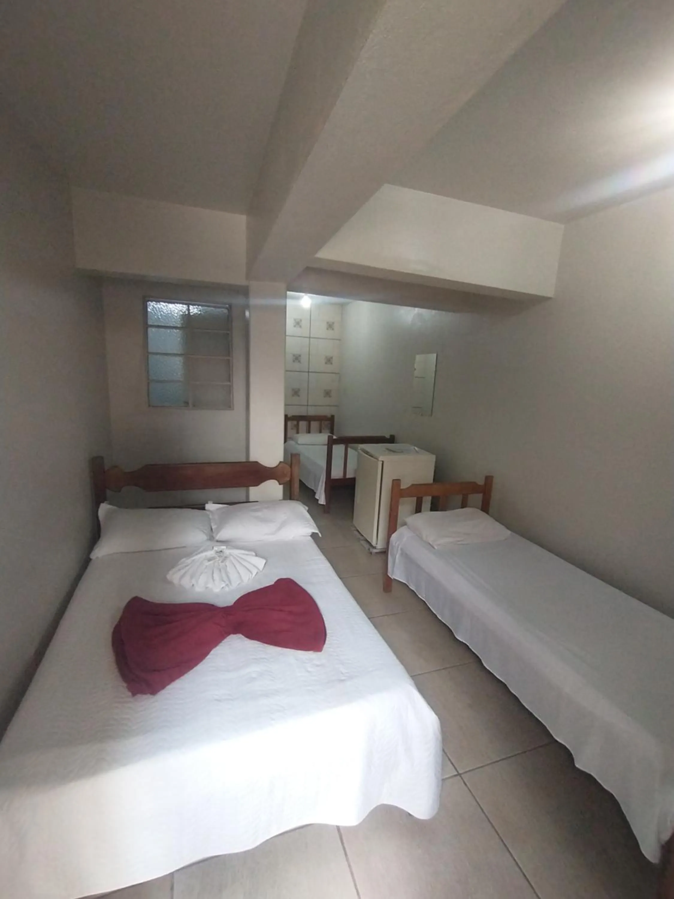 Bed in Pousada Acayaca