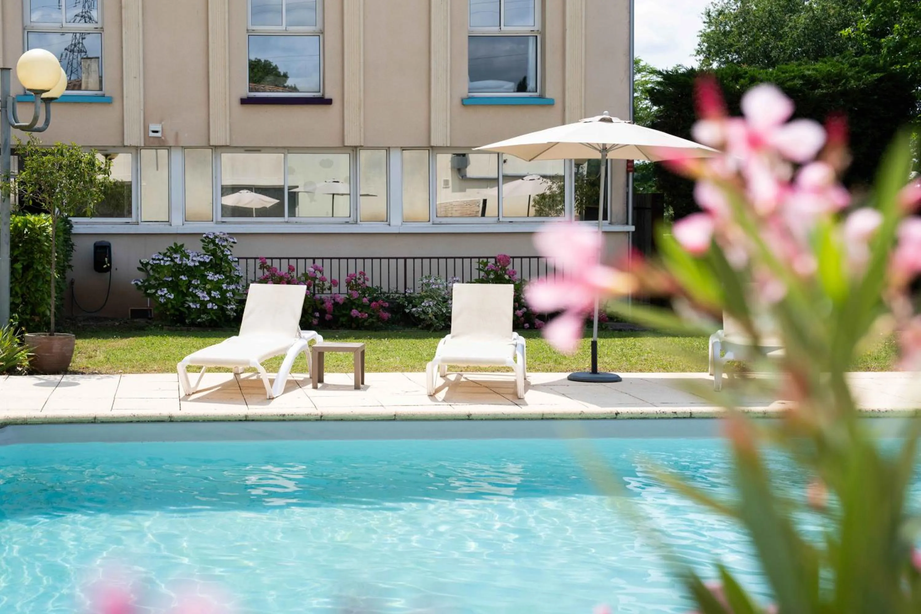 Swimming pool in Logis Hôtel & Restaurant Ludik