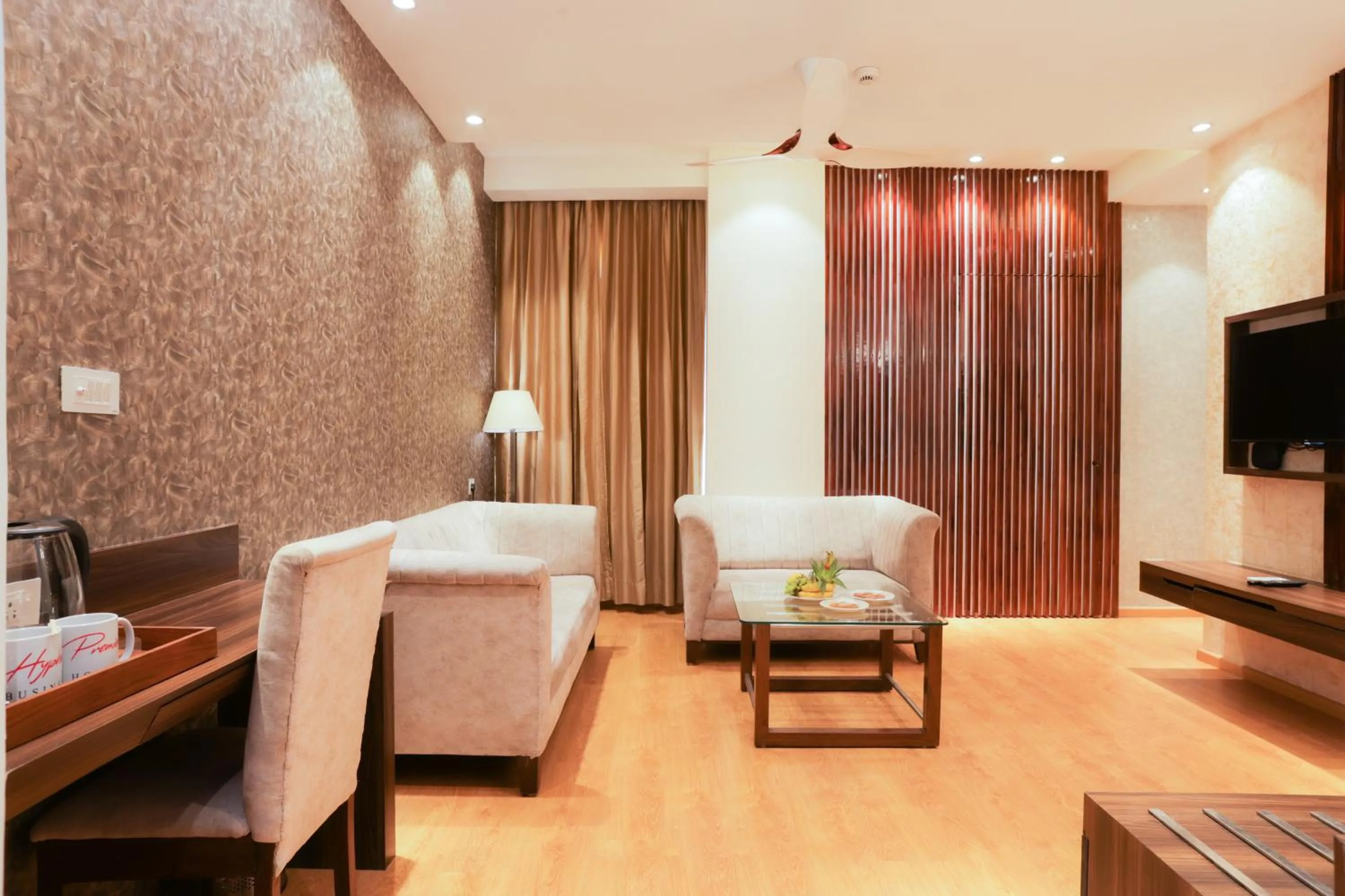 Living room, Bed in Hyphen Premier-Business Hotel