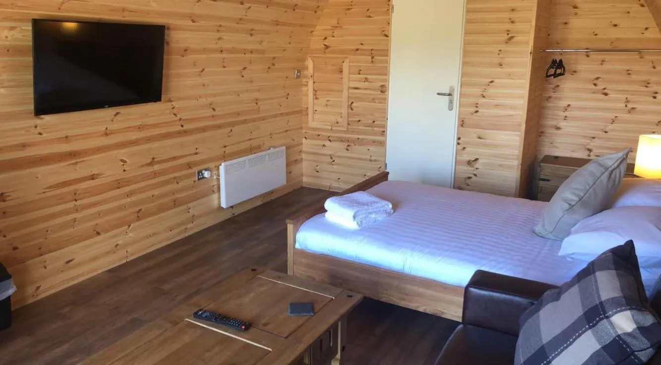 Bed in Superior Glamping Pod with Hot Tub