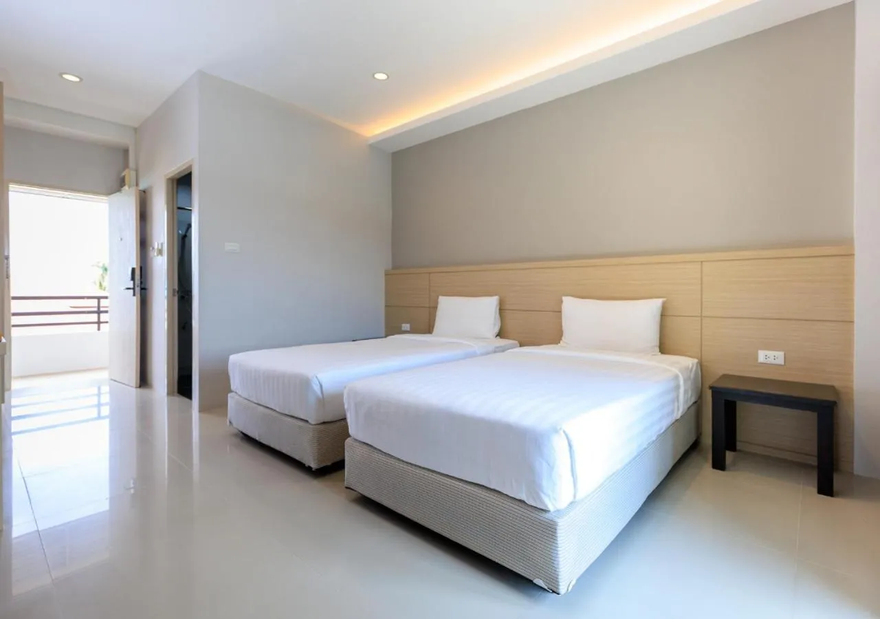 Bed in Baan Phor Phan Hotel