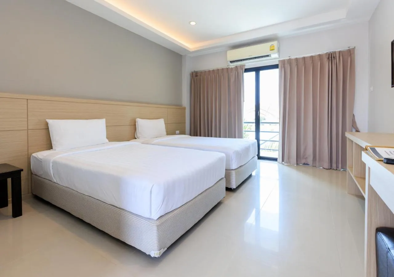 Bed in Baan Phor Phan Hotel