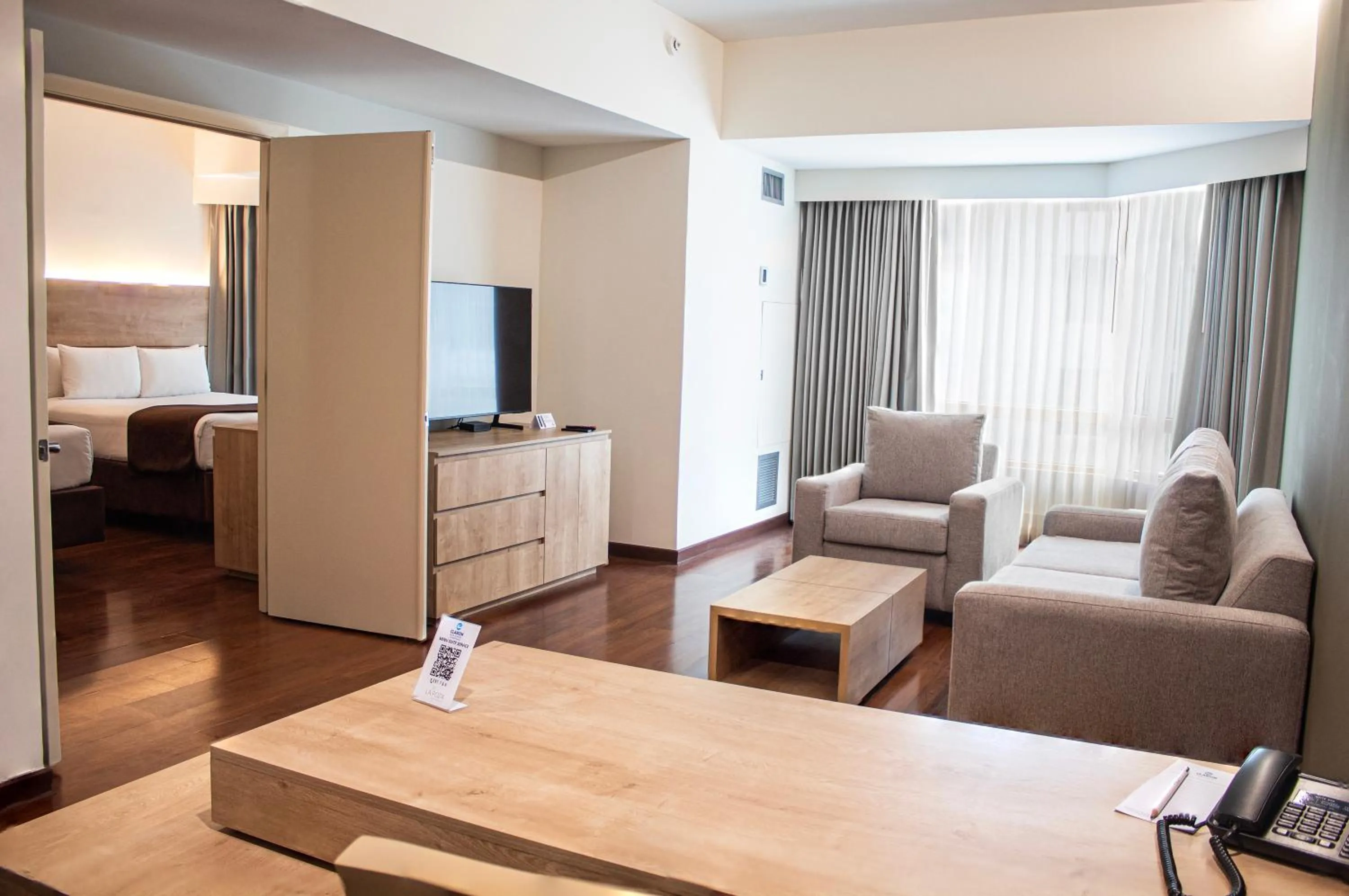 Living room, Bed in Clarion Suites Guatemala City