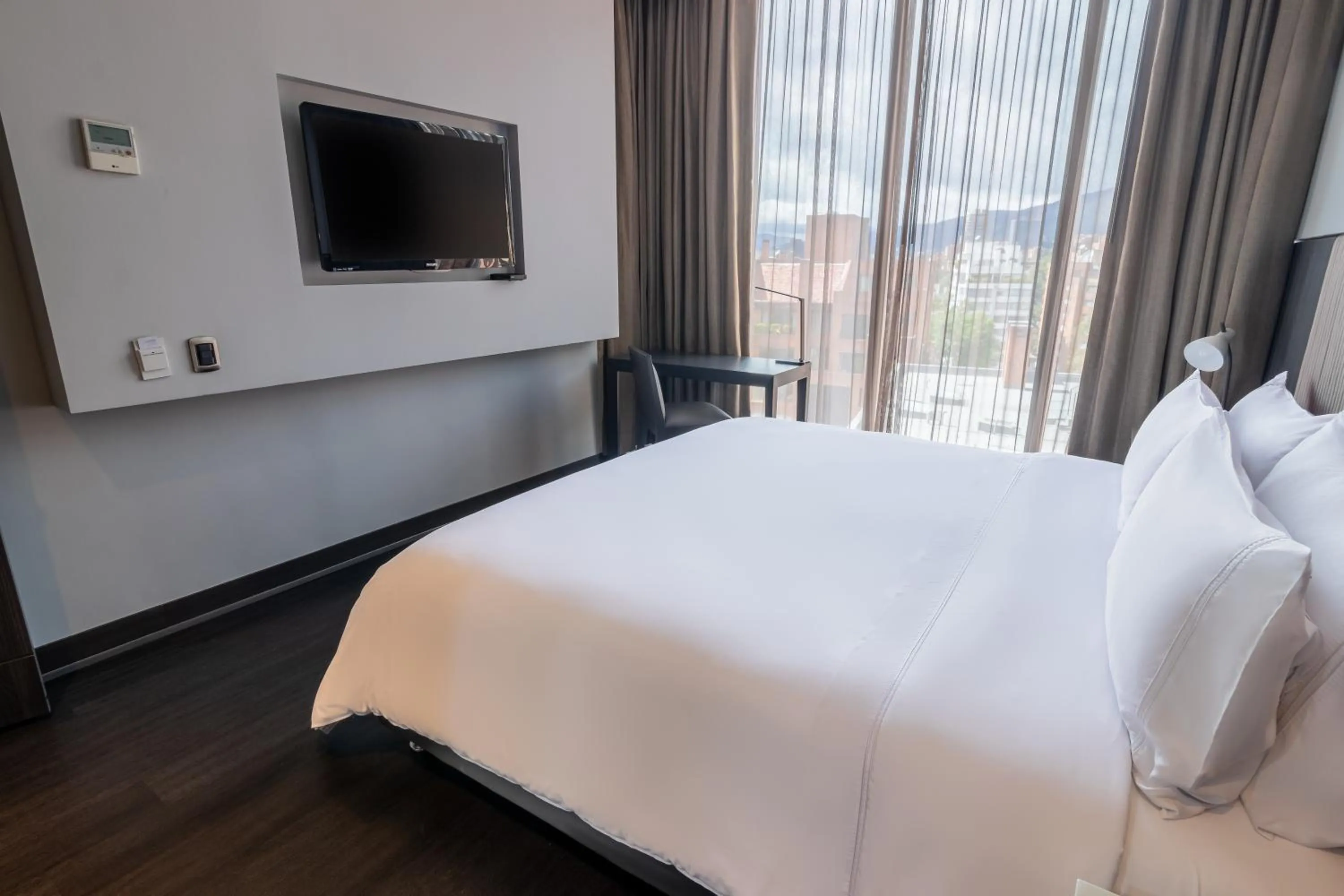 Bed in GHL Bioxury Hotel