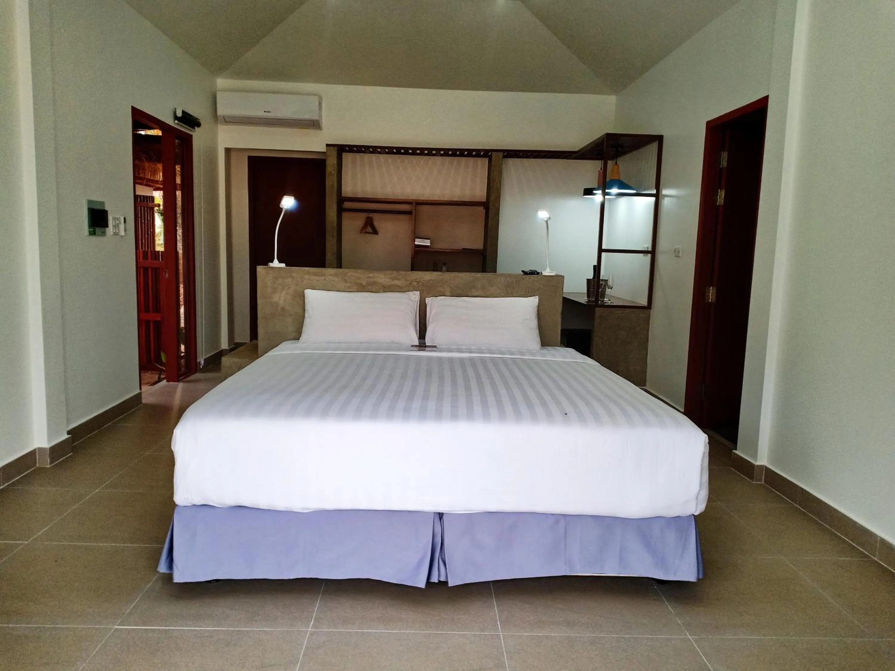 Bed in The Sanctuary Nam Ngum Beach Resort