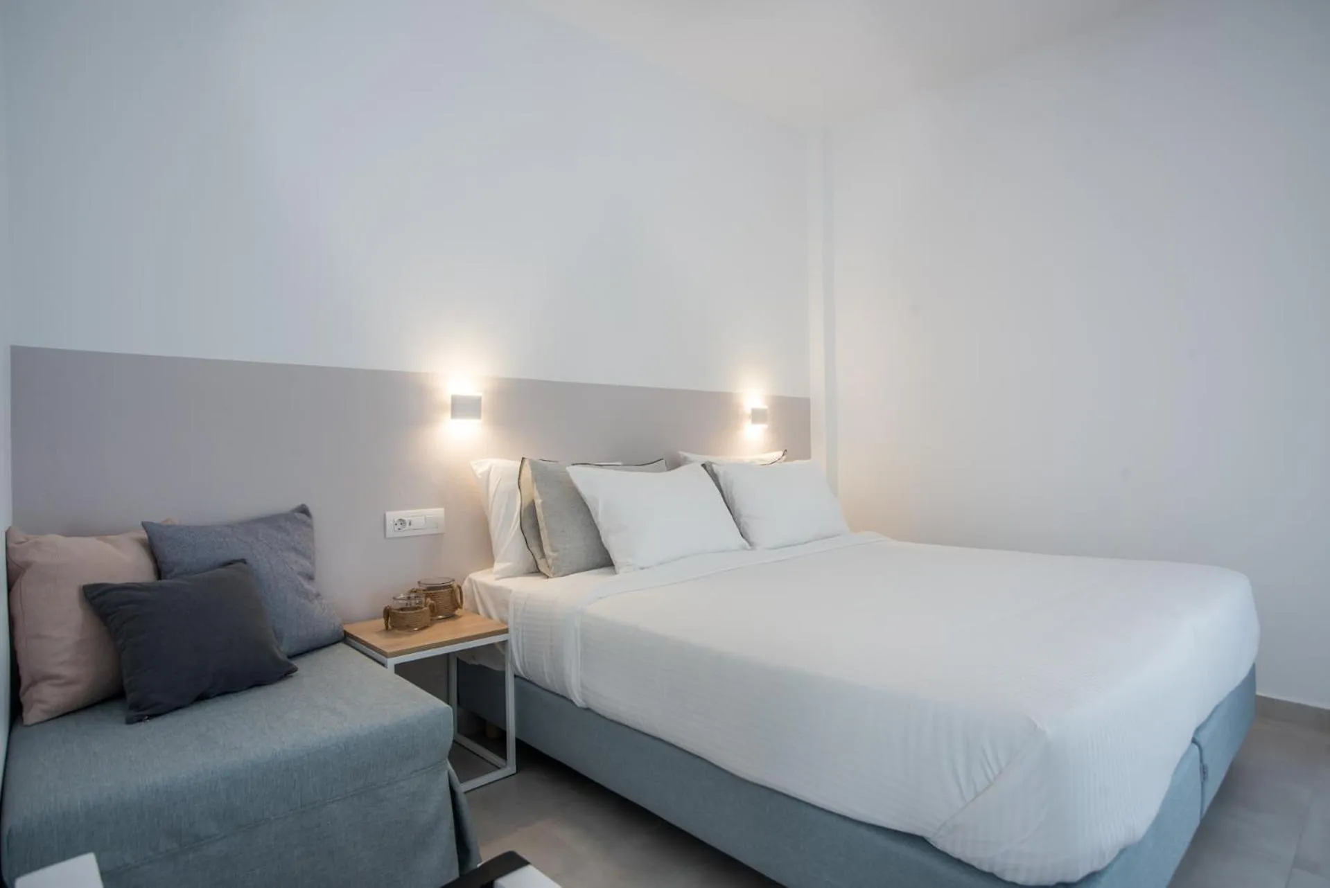 Bed in Nautilus Apartments-Suites