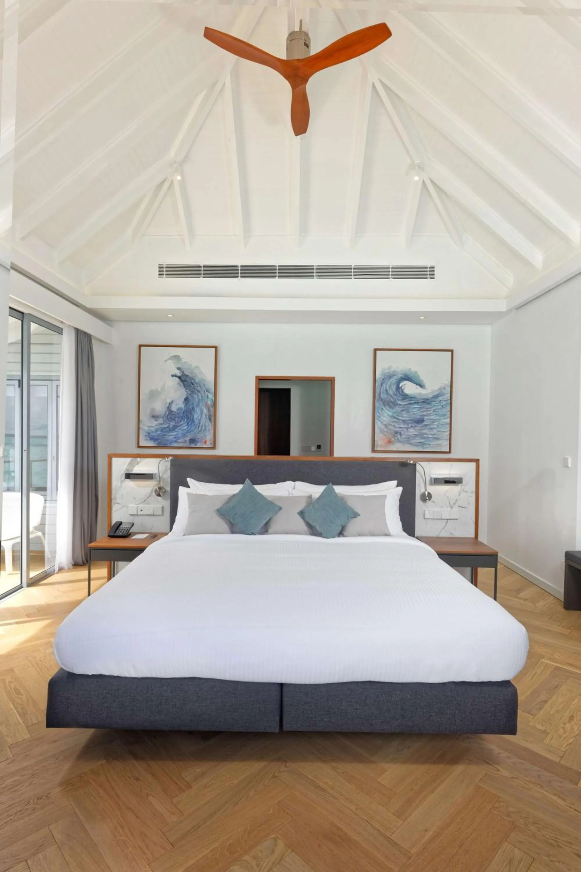 Photo of the whole room, Bed in OUTRIGGER Maldives Maafushivaru Resort - 25 percent discount on transfers for min 4 nights stay and more, valid for reservations between 01 July till 22 Dec 2025