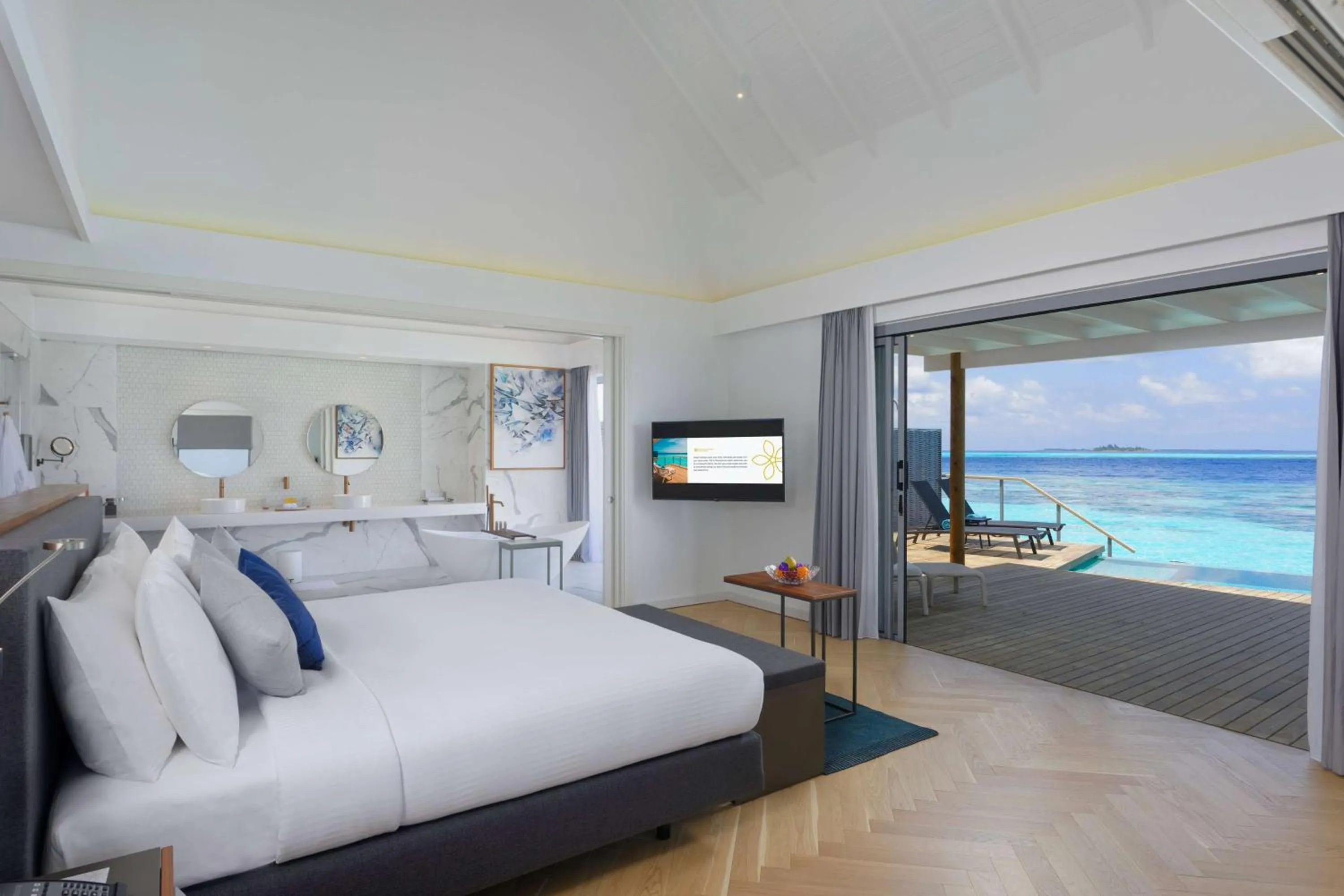 Photo of the whole room, Bed in OUTRIGGER Maldives Maafushivaru Resort - 25 percent discount on transfers for min 4 nights stay and more, valid for reservations between 01 July till 22 Dec 2025