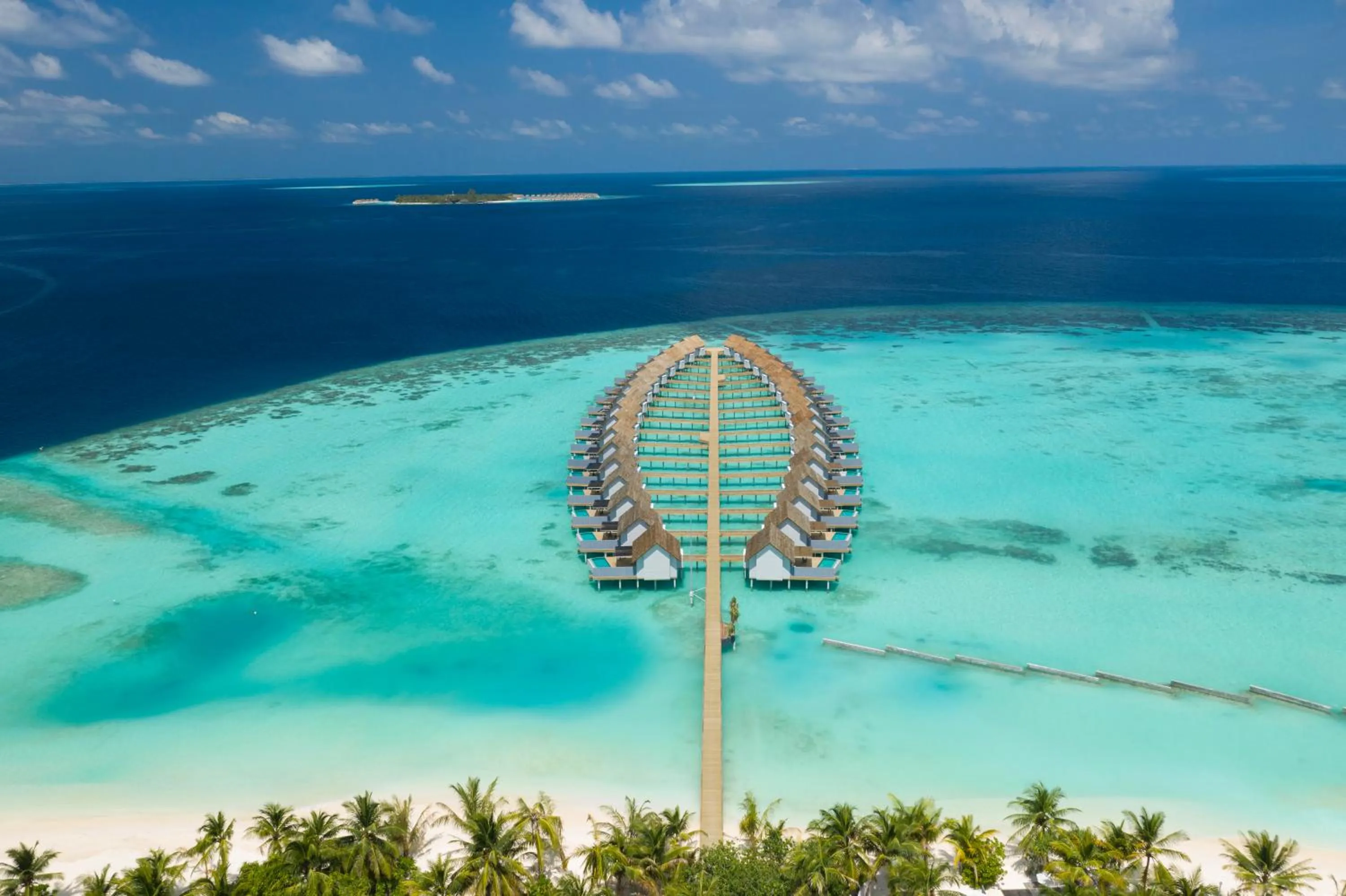 Pool view in OUTRIGGER Maldives Maafushivaru Resort - 25 percent discount on transfers for min 4 nights stay and more, valid for reservations between 01 July till 22 Dec 2025
