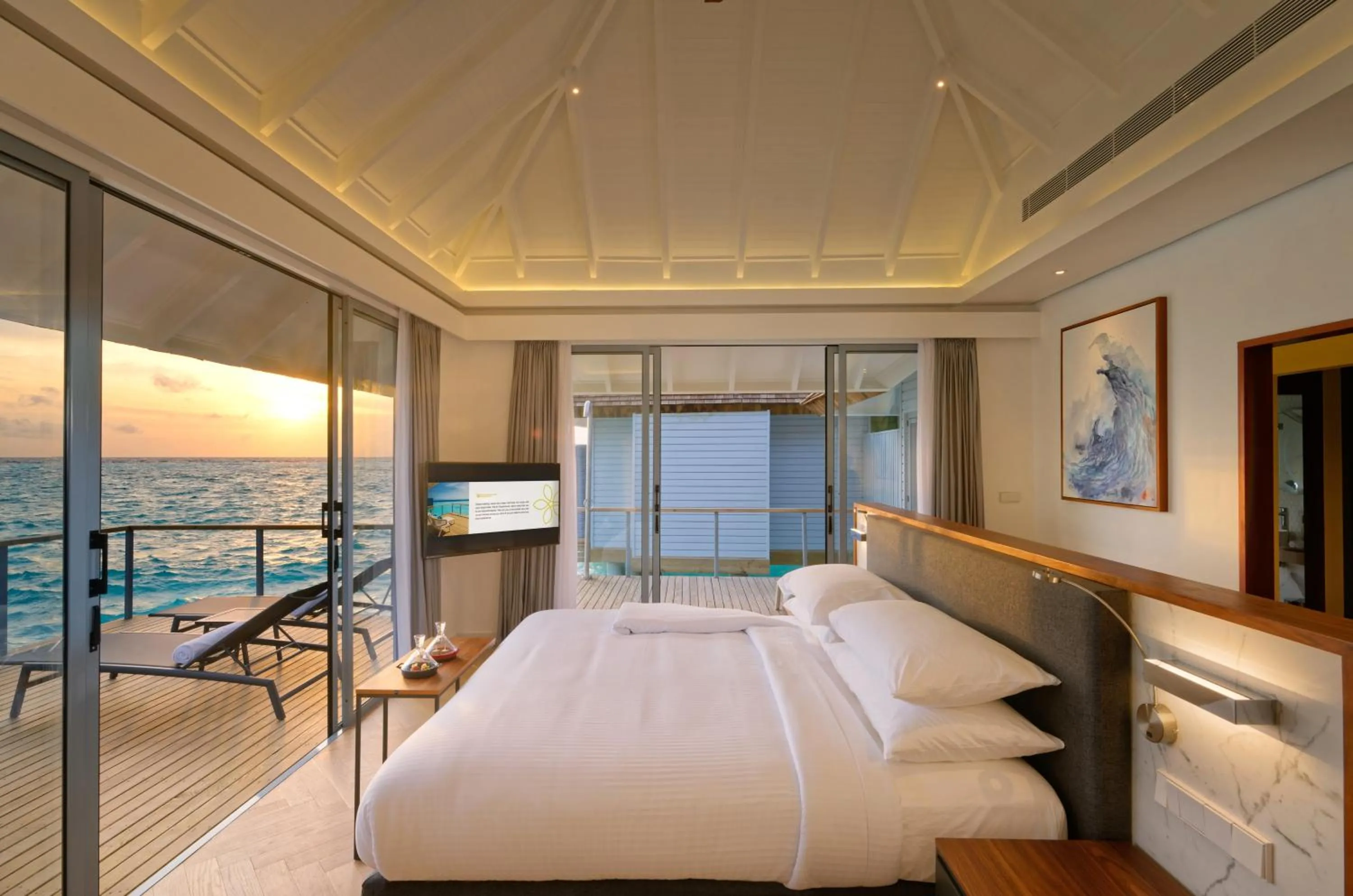 TV and multimedia, Bed in OUTRIGGER Maldives Maafushivaru Resort - 25 percent discount on transfers for min 4 nights stay and more, valid for reservations between 01 July till 22 Dec 2025