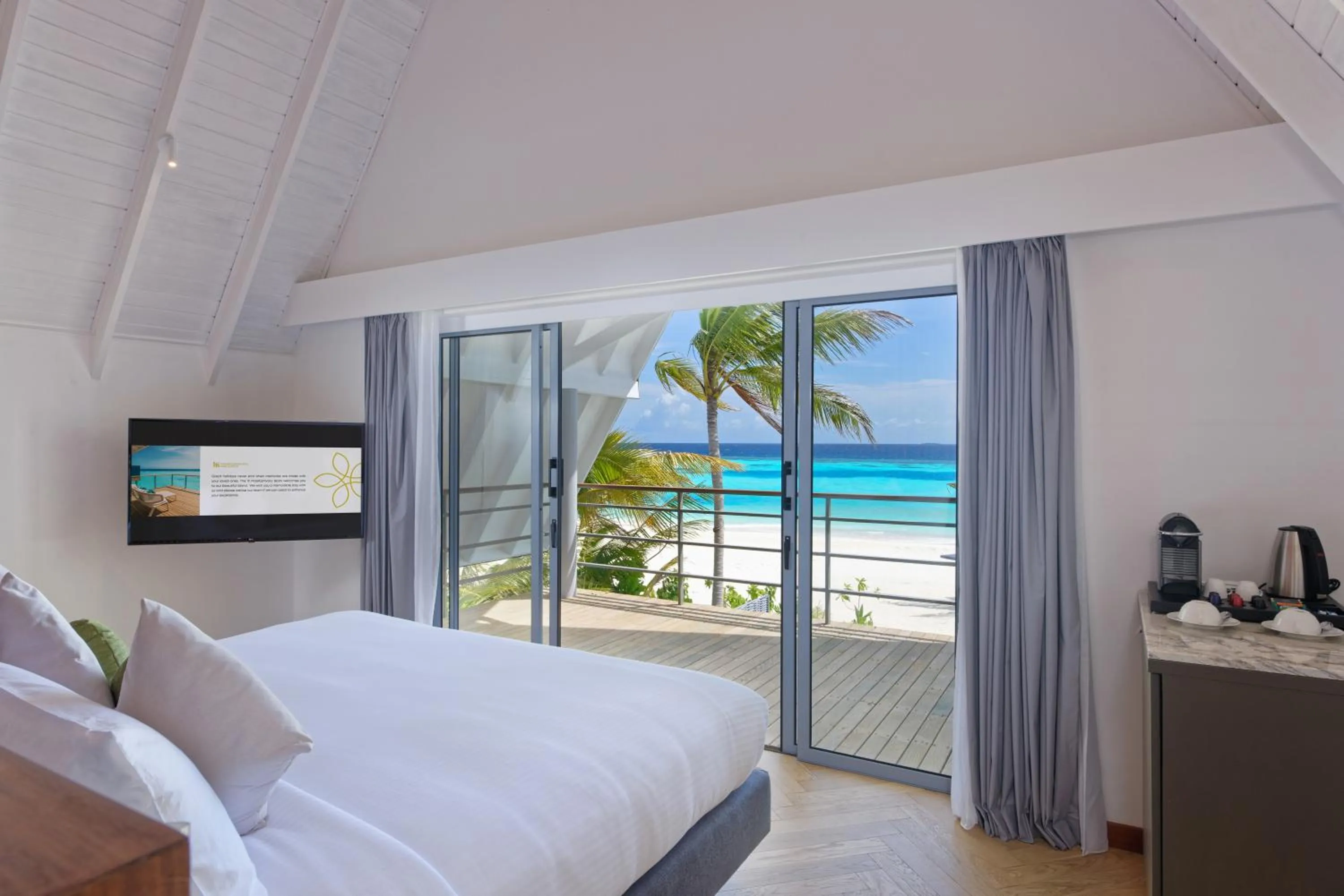 TV and multimedia, Bed in OUTRIGGER Maldives Maafushivaru Resort - 25 percent discount on transfers for min 4 nights stay and more, valid for reservations between 01 July till 22 Dec 2025