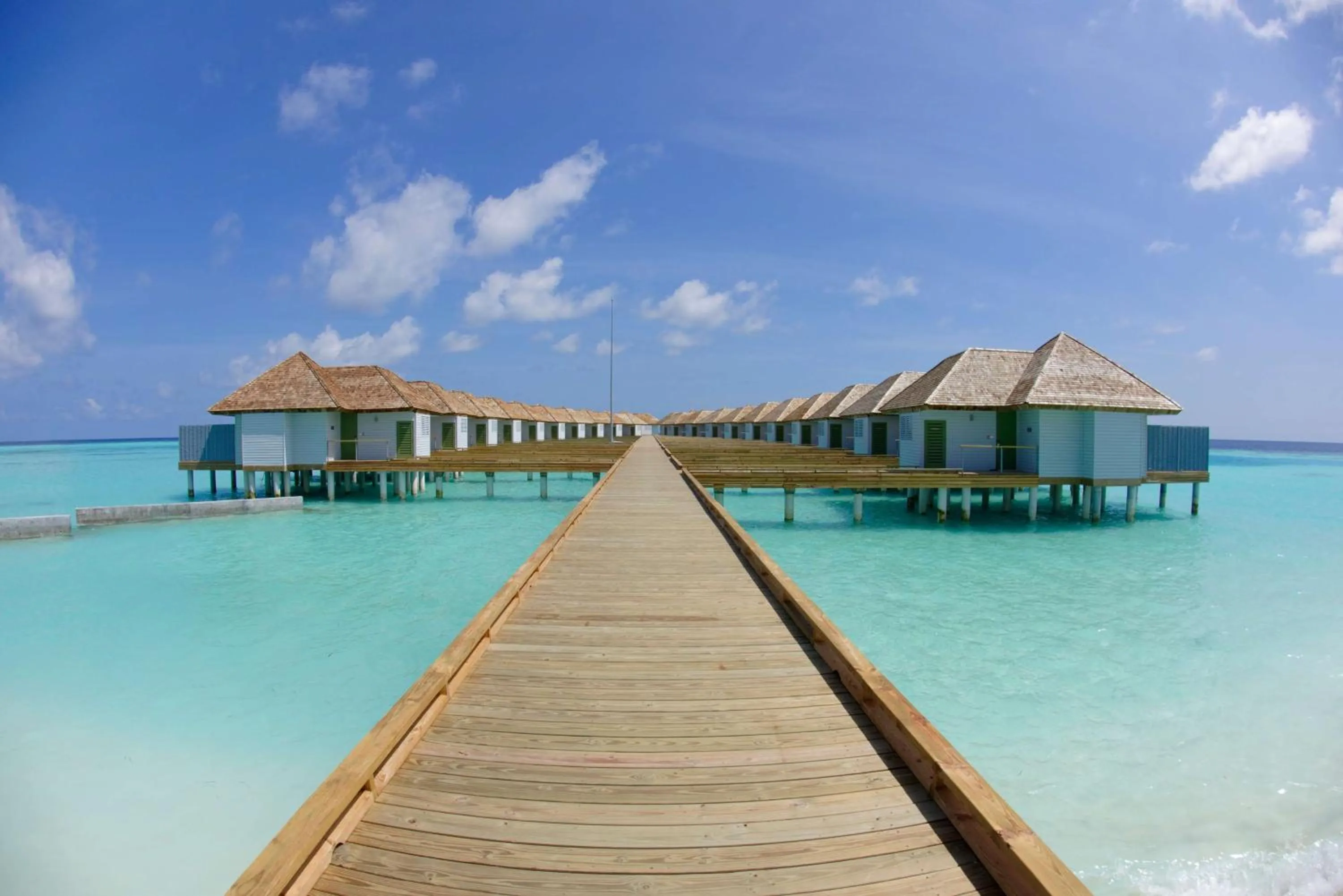 Property building in OUTRIGGER Maldives Maafushivaru Resort - 25 percent discount on transfers for min 4 nights stay and more, valid for reservations between 01 July till 22 Dec 2025