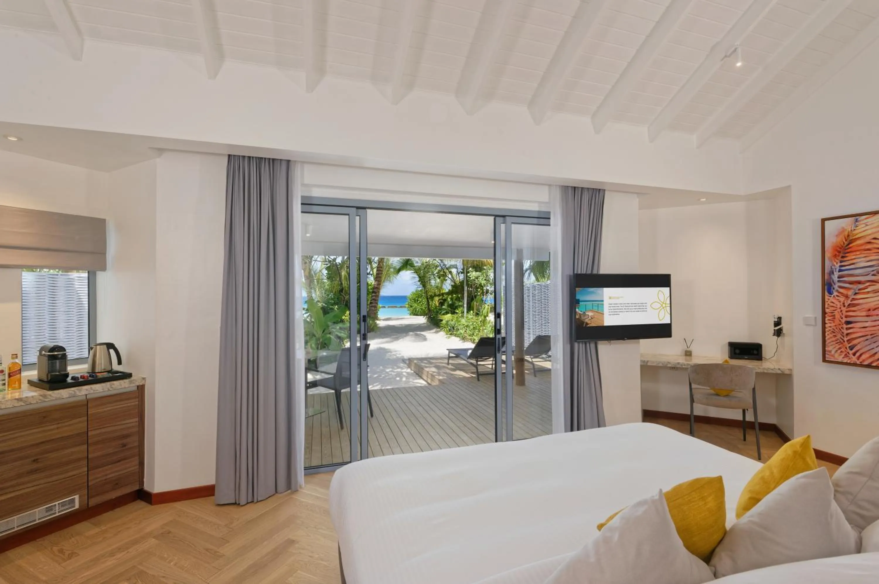 Coffee/tea facilities, Bed in OUTRIGGER Maldives Maafushivaru Resort - 25 percent discount on transfers for min 4 nights stay and more, valid for reservations between 01 July till 22 Dec 2025