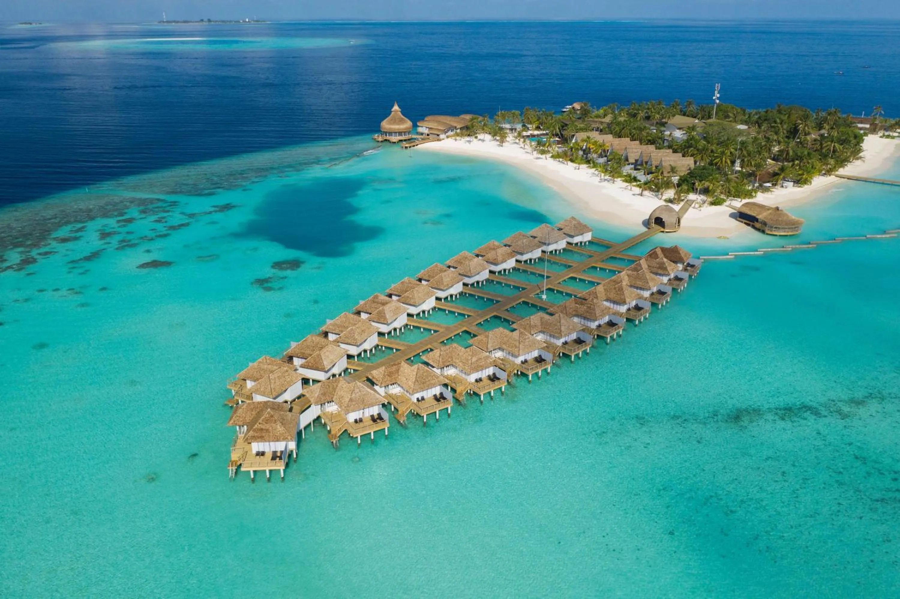 Property building in OUTRIGGER Maldives Maafushivaru Resort - 25 percent discount on transfers for min 4 nights stay and more, valid for reservations between 01 July till 22 Dec 2025