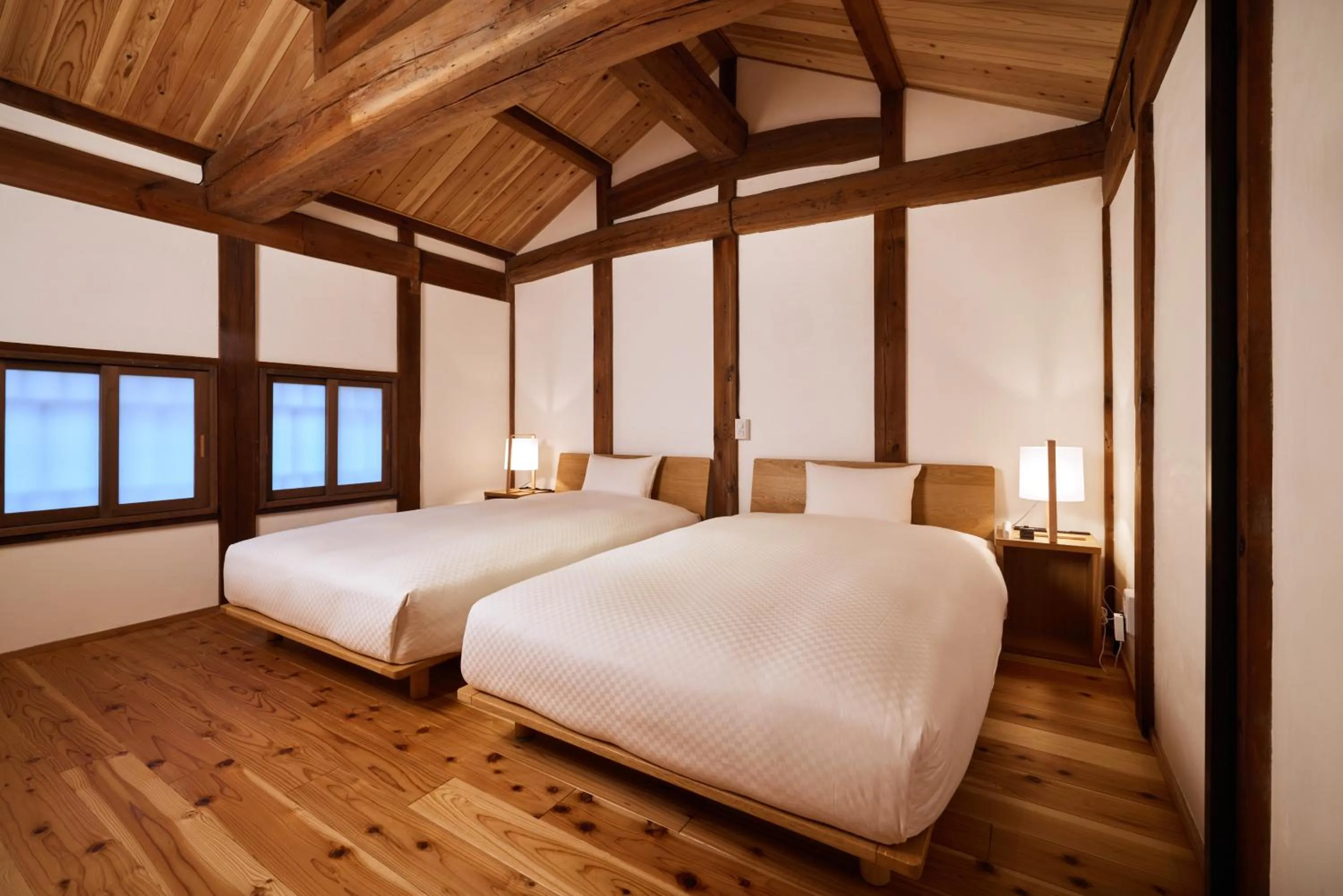 Bed in NIPPONIA HOTEL Takehara Saltworks Town