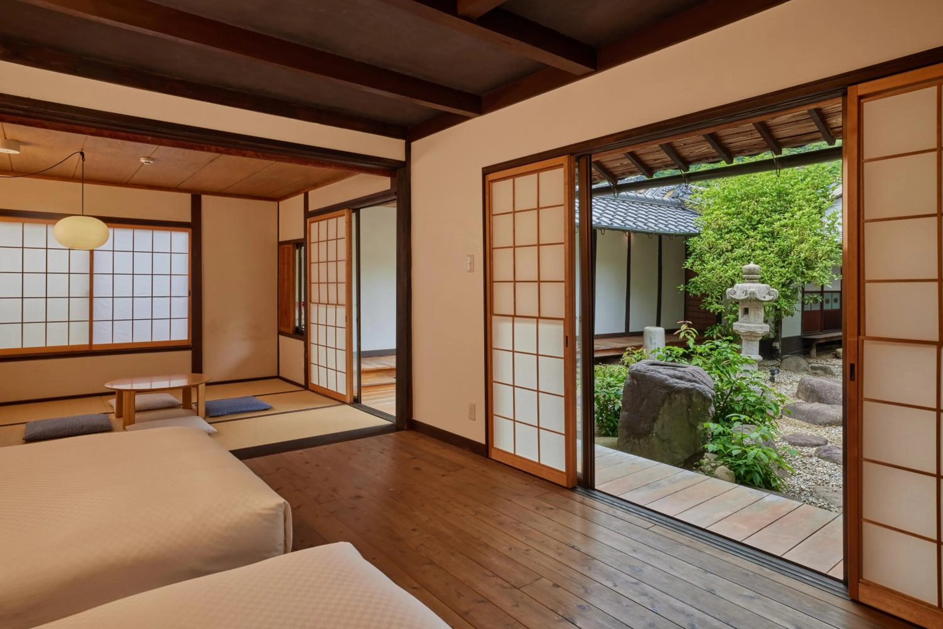 Bed in NIPPONIA HOTEL Takehara Saltworks Town