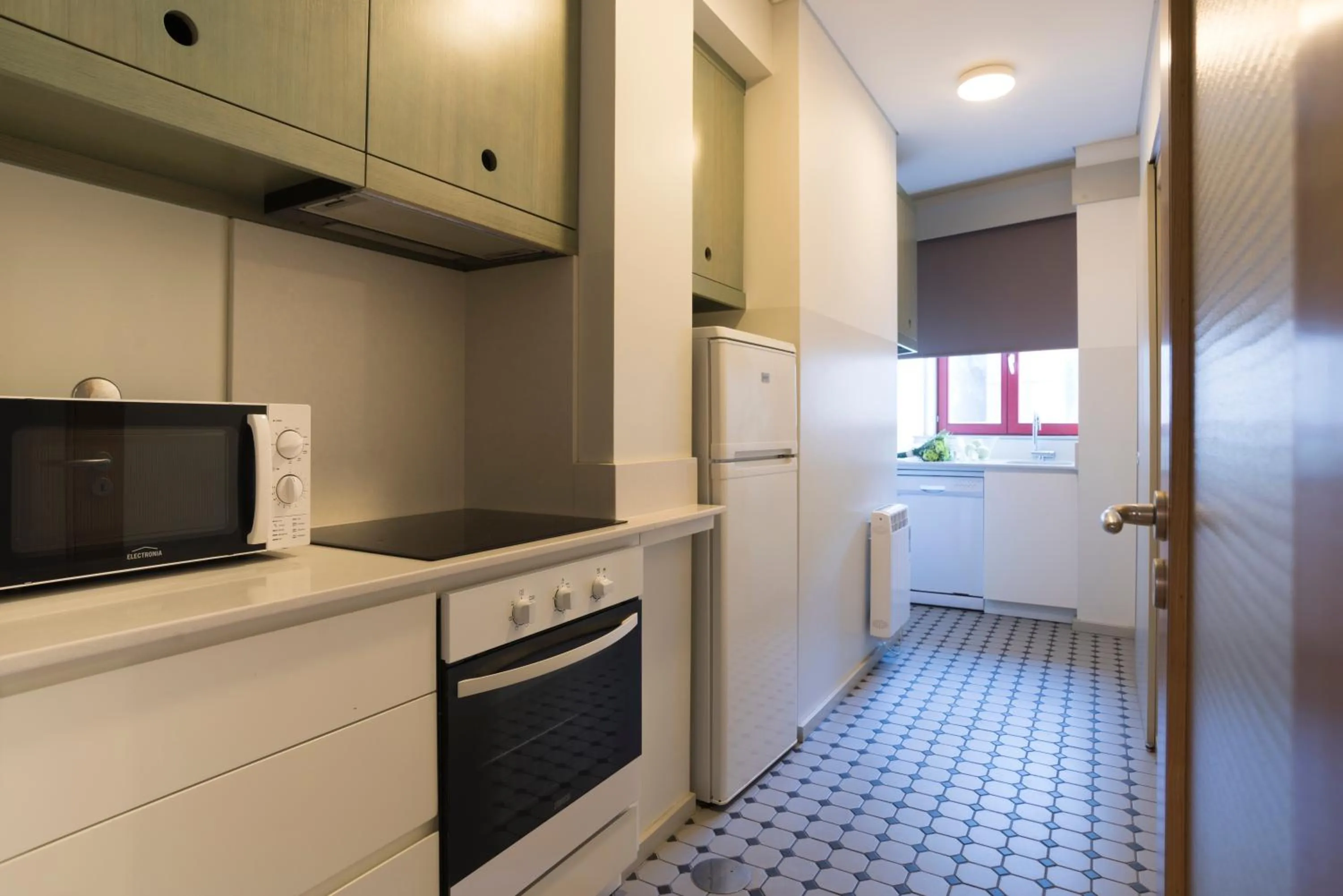 Kitchen or kitchenette in bnapartments Trindade