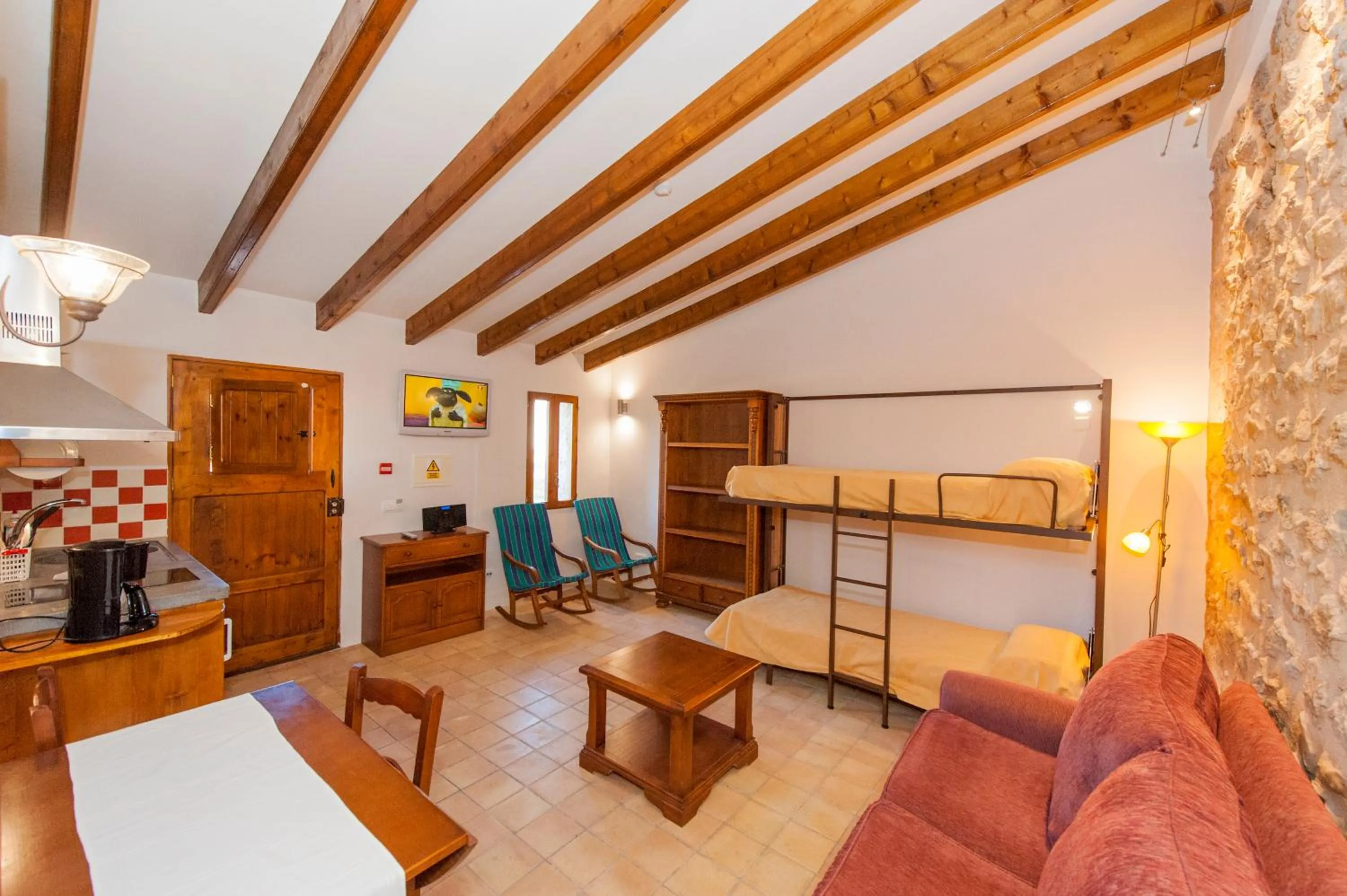 Kitchen or kitchenette, Bed in Finca Hotel Ses Cases Noves