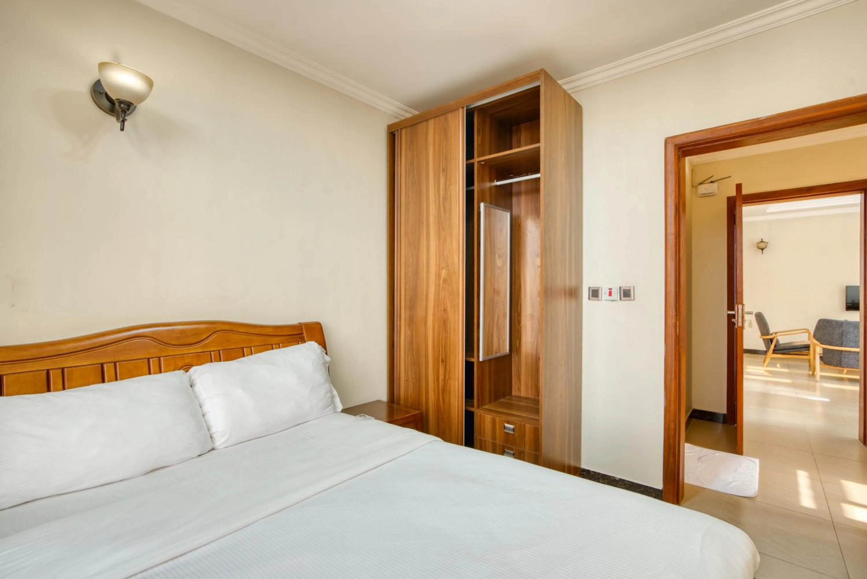 Bed in Kibo Palace Apartments