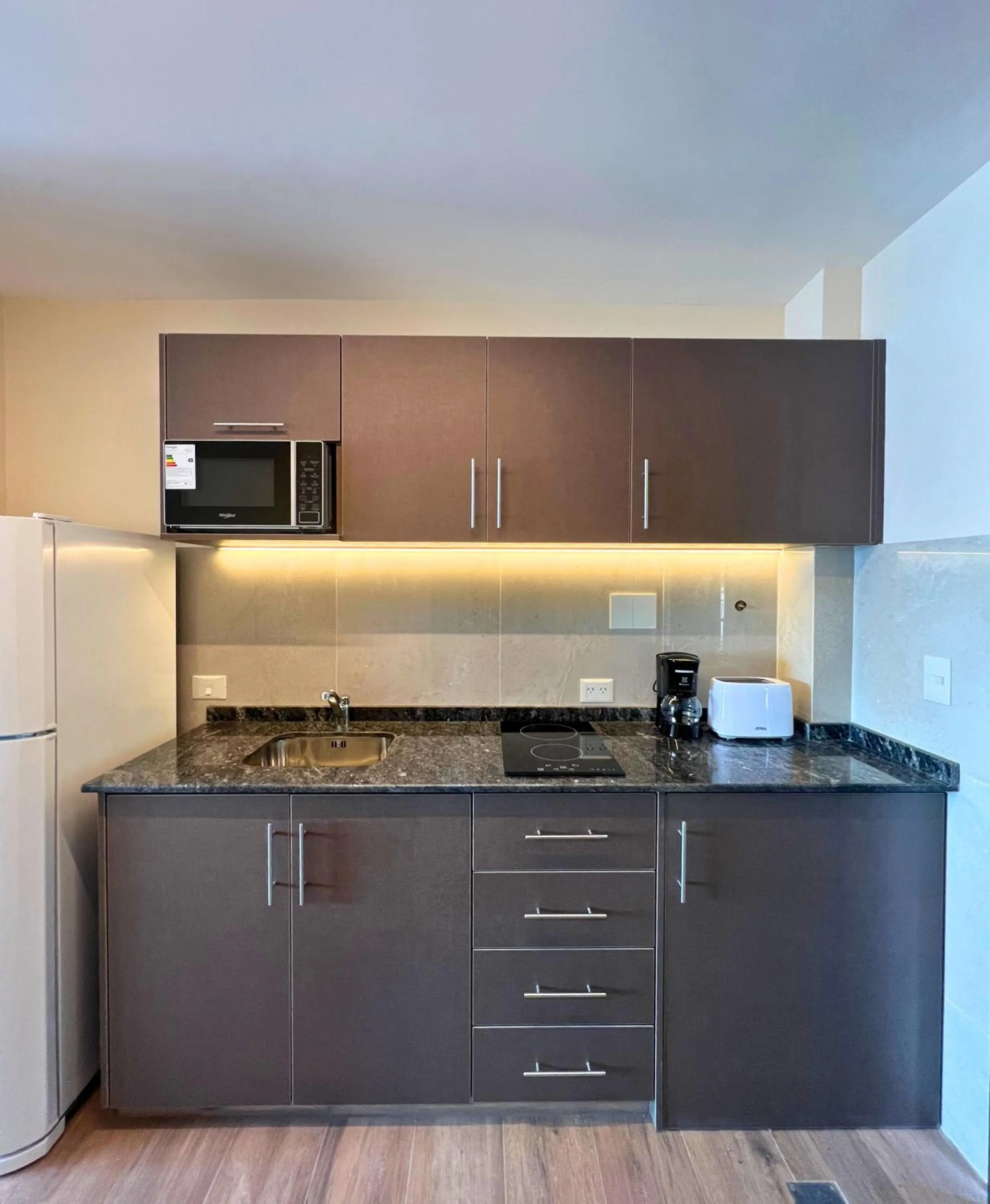 kitchen in Huinid Pioneros Hotel & Aparts