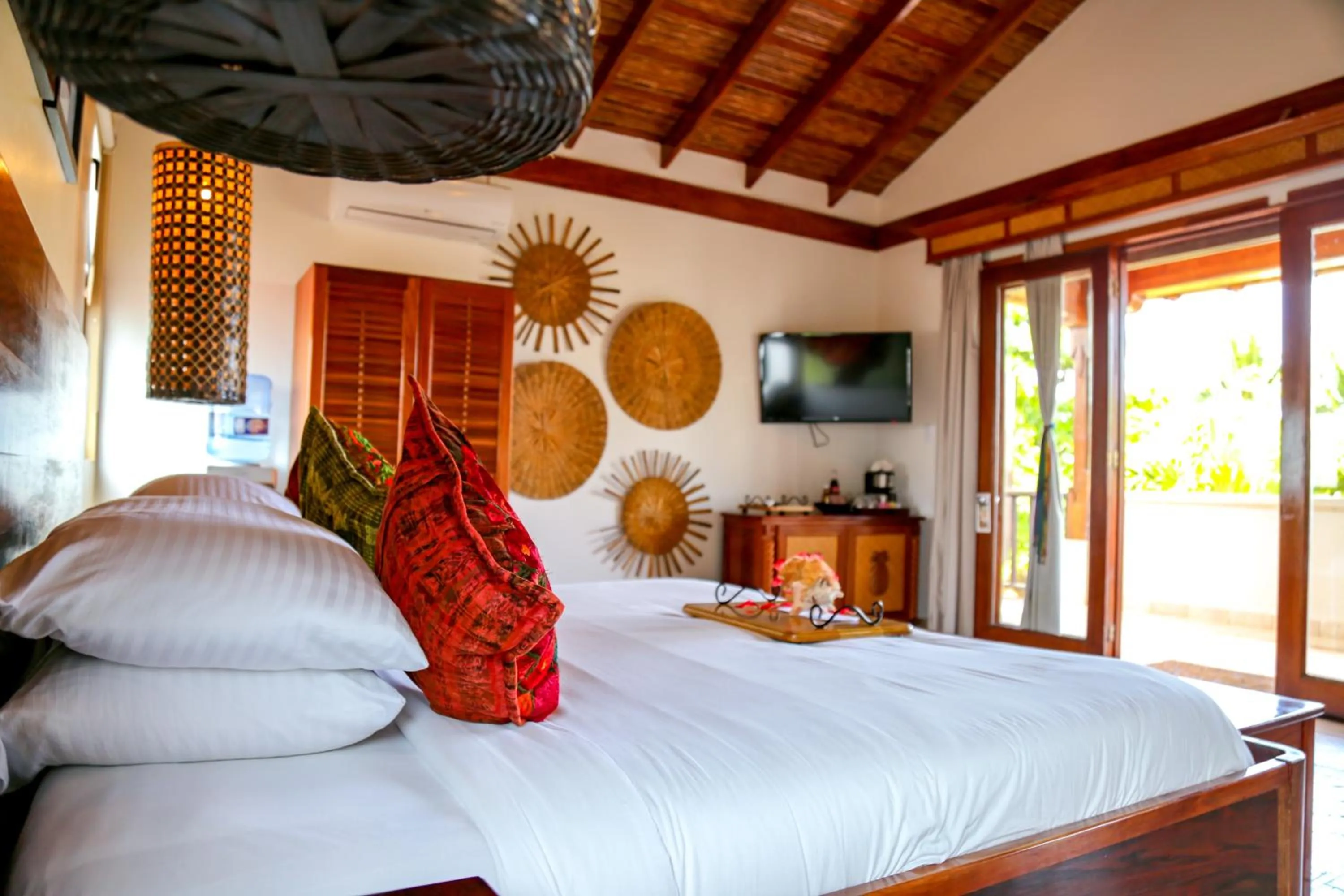 Bed in Almond Beach Resort at Jaguar Reef