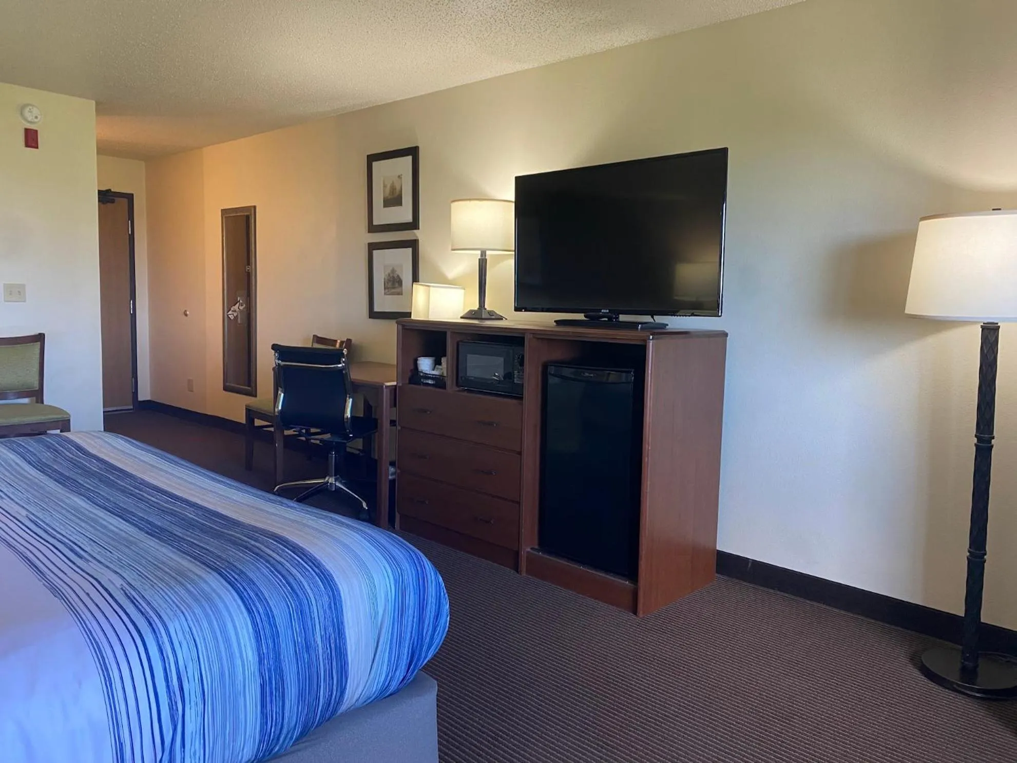 Bed in AmericInn by Wyndham Two Harbors Near Lake Superior