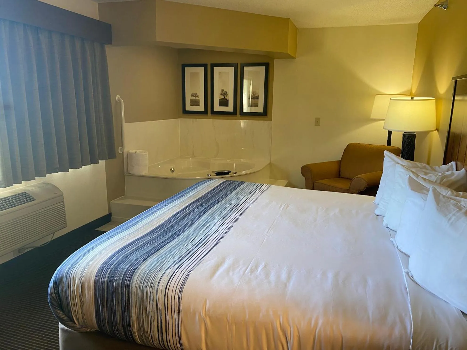 Bed in AmericInn by Wyndham Two Harbors Near Lake Superior