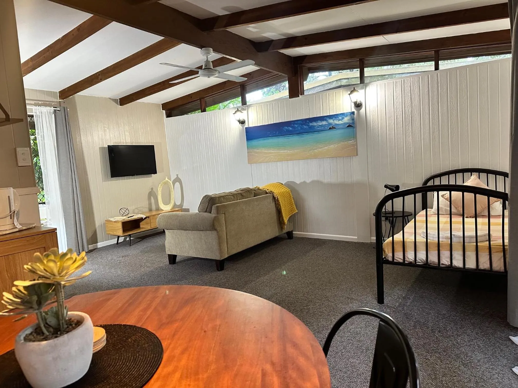 Bed in Colonial Village Resort