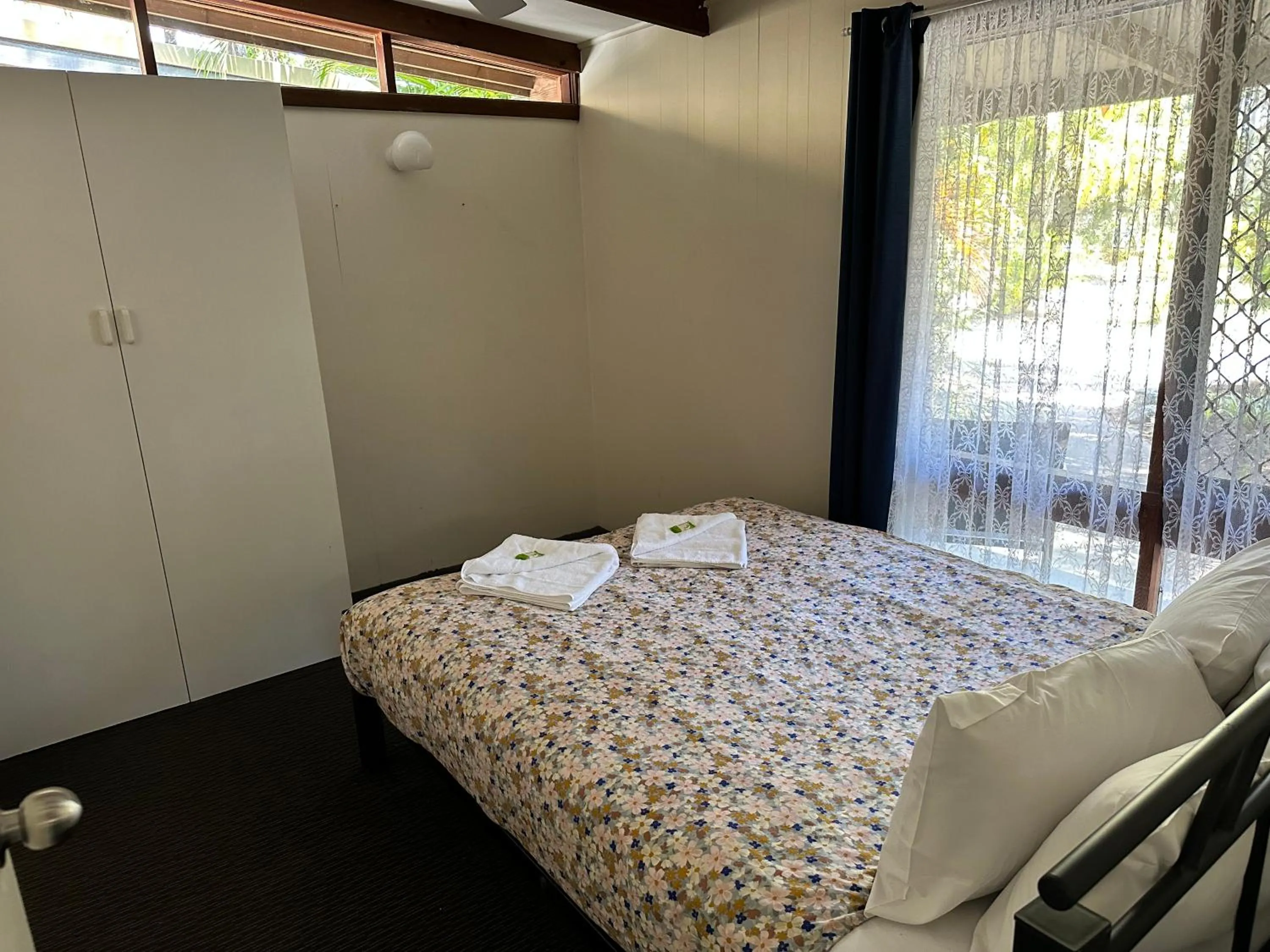 Bed in Colonial Village Resort