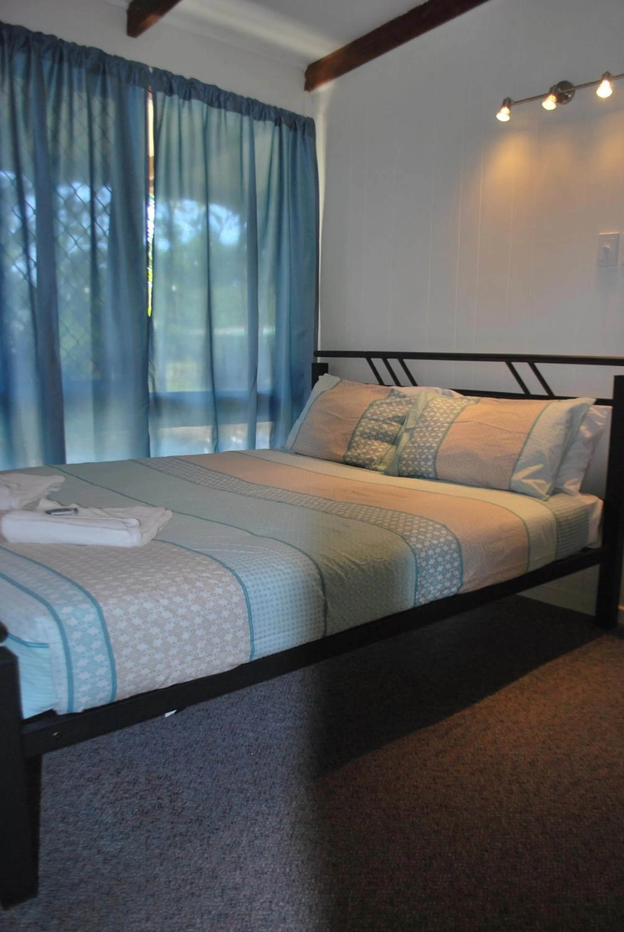 Bed in Colonial Village Resort