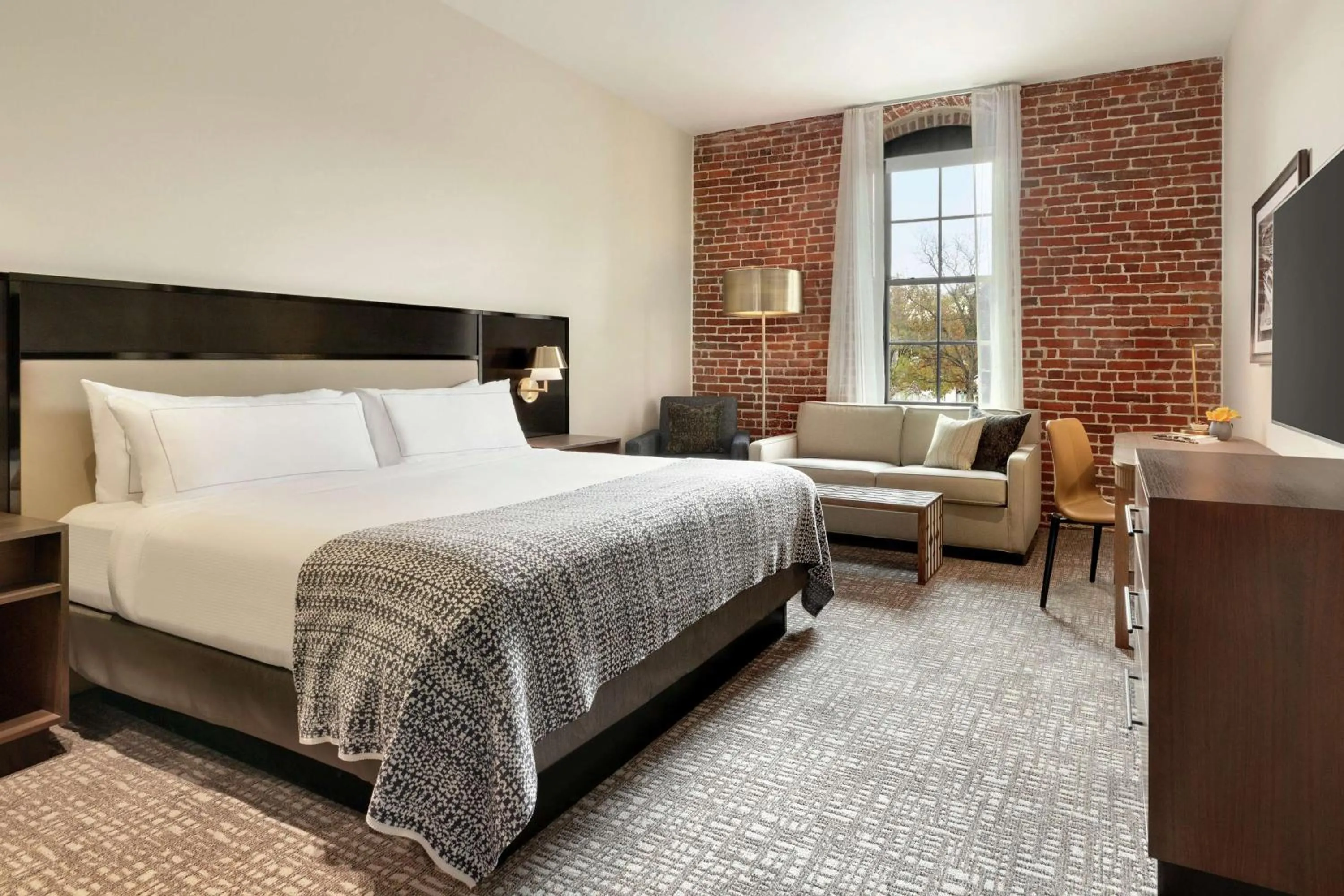 Living room, Bed in The Wilbur Lititz, Tapestry Collection By Hilton