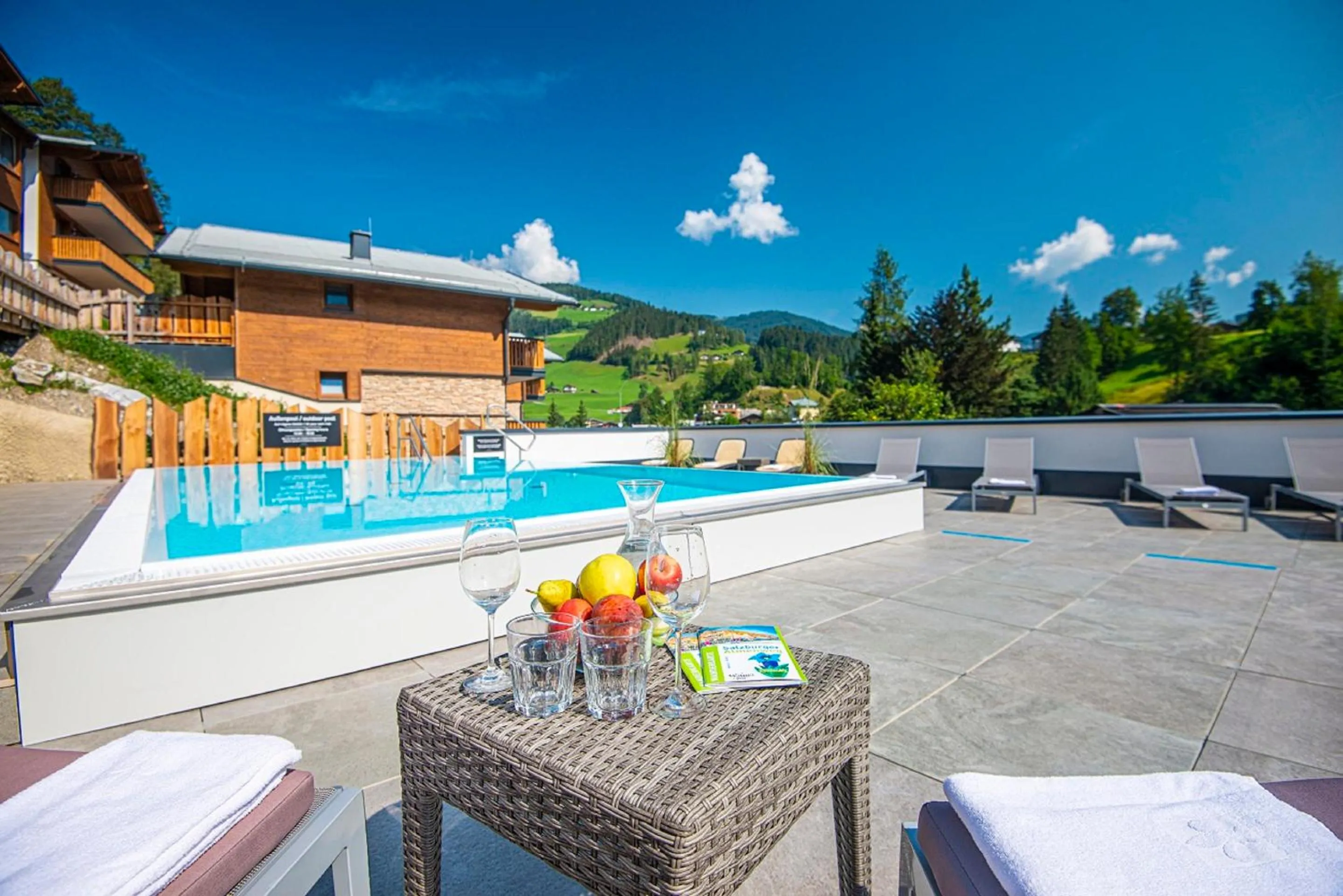 Pool view in Apartment Dorf Wagrain Alpenleben by AlpenTravel