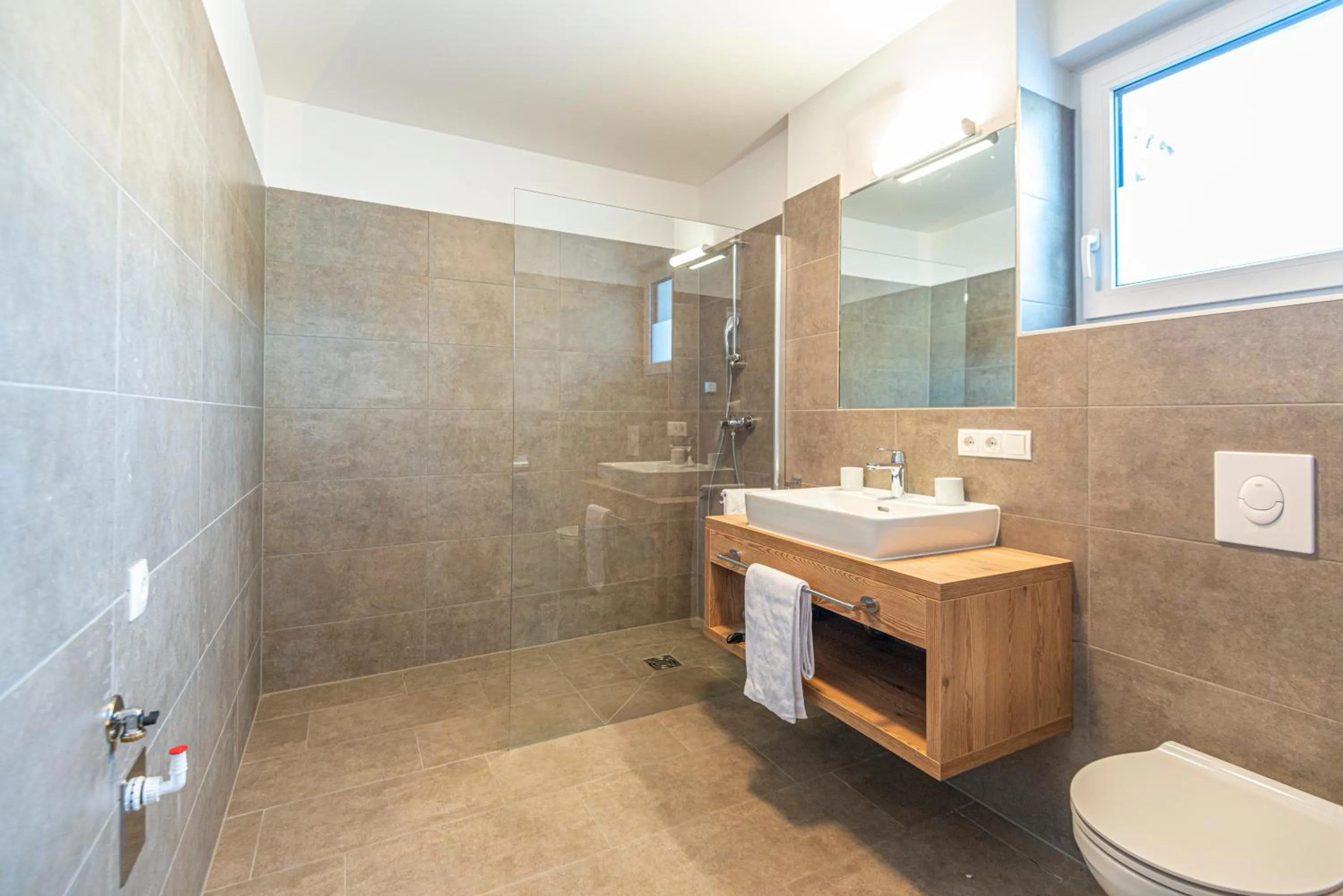 Bathroom in Apartment Dorf Wagrain Alpenleben by AlpenTravel