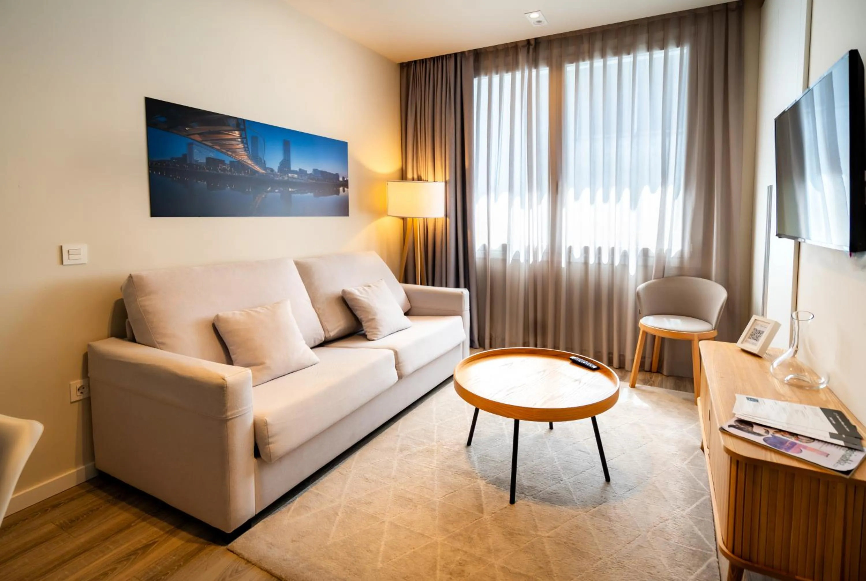 Living room in Bilbao City Center by abba Suites